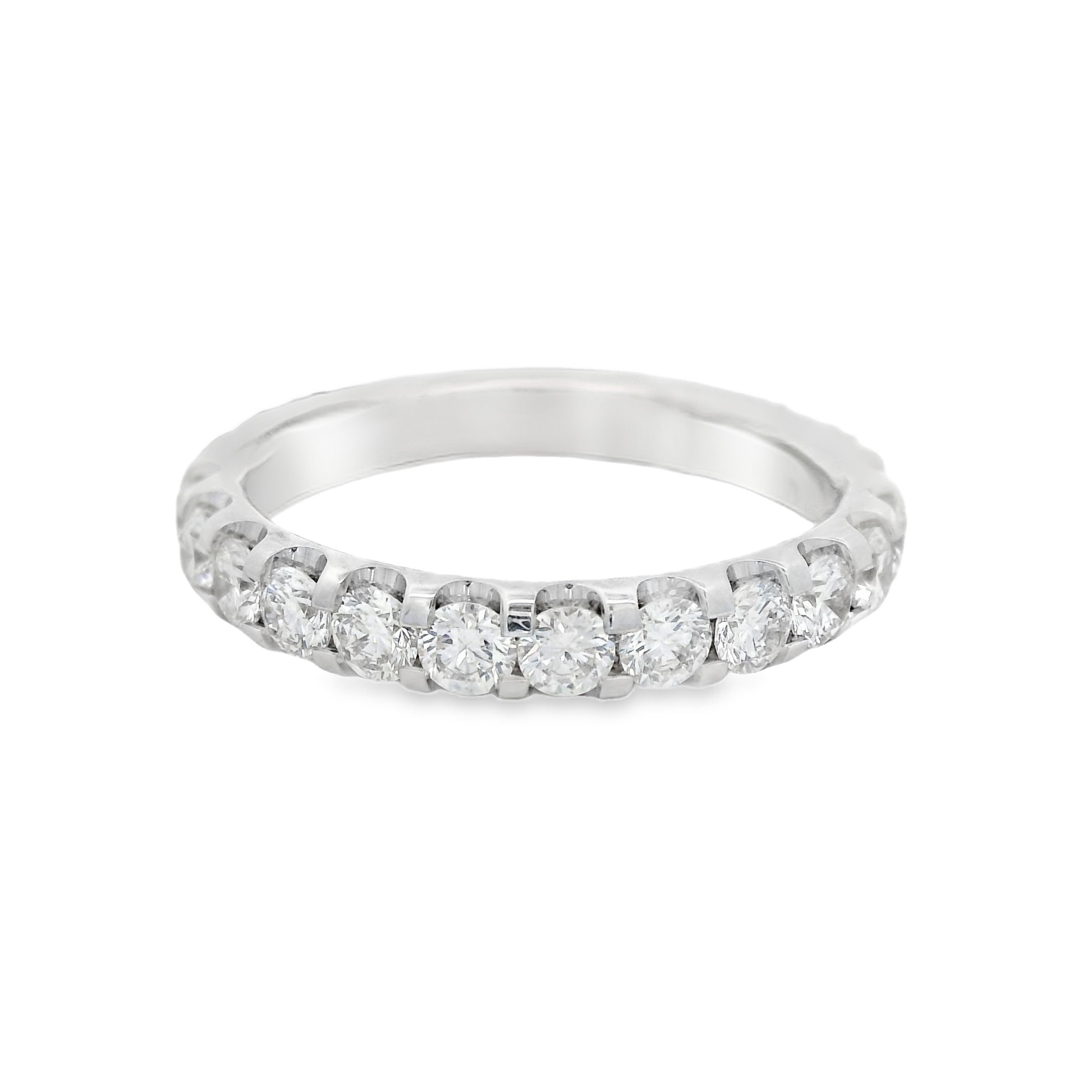 This "U Prong" eternity band in 18k white gold features shared prong set round diamonds, offering a sleek and modern design with continuous sparkle. A sophisticated choice for any occasion, it beautifully combines elegance with timeless appeal.-18k White gold-Round diamonds, 1.51cts-Size 6, Contact for sizing optionsItem# 110-2000049 Round U Prong Eternity Band