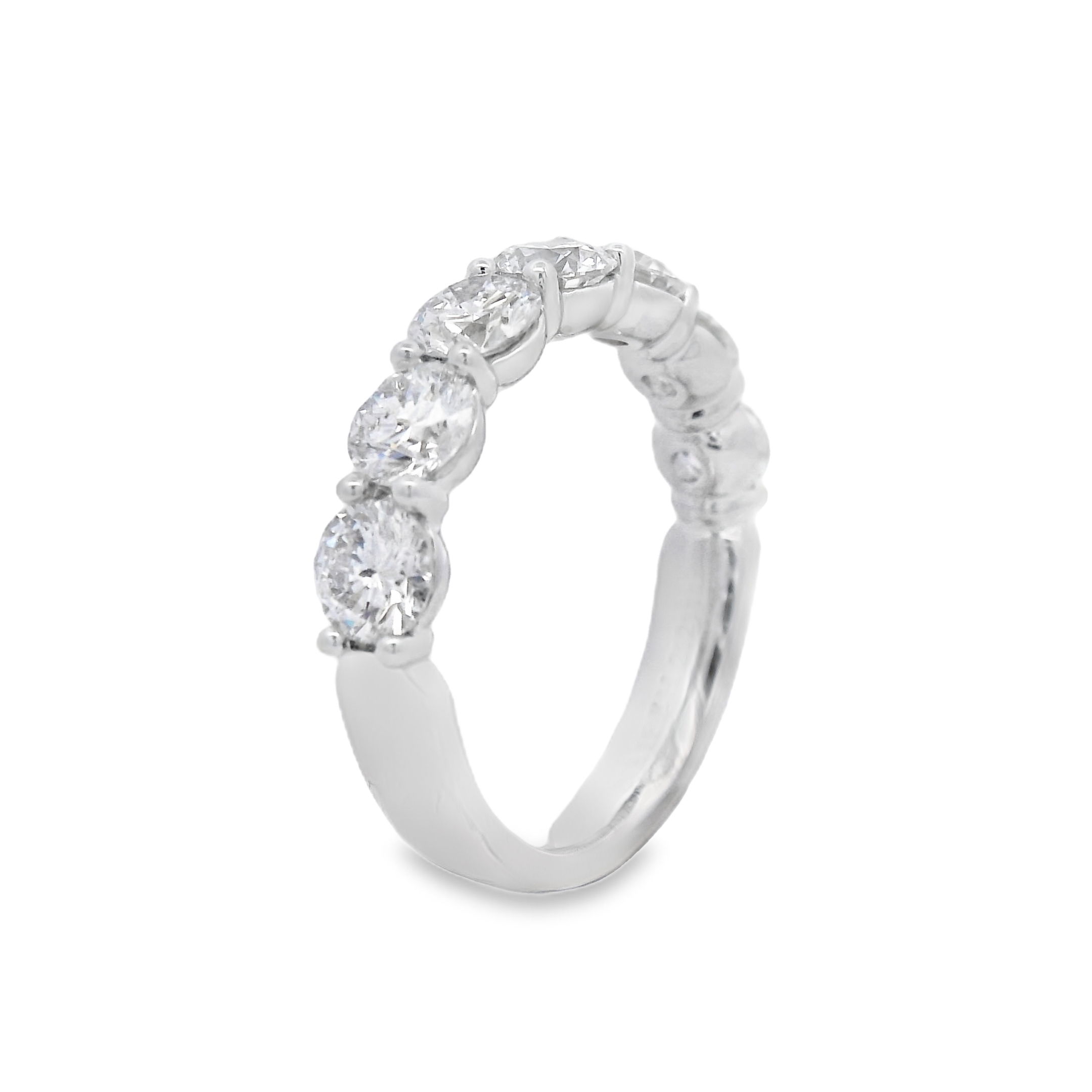This 18k white gold anniversary band features round diamonds set in a unique "buttercup" setting, enhancing their brilliance with a timeless and elegant design. A perfect way to celebrate your love, this band adds a sophisticated touch to any engagement ring.-18k White gold-Round diamonds, 2.05cts-Size 6, Contact for sizing optionsItem# 130-2000054 Round Buttercup Band