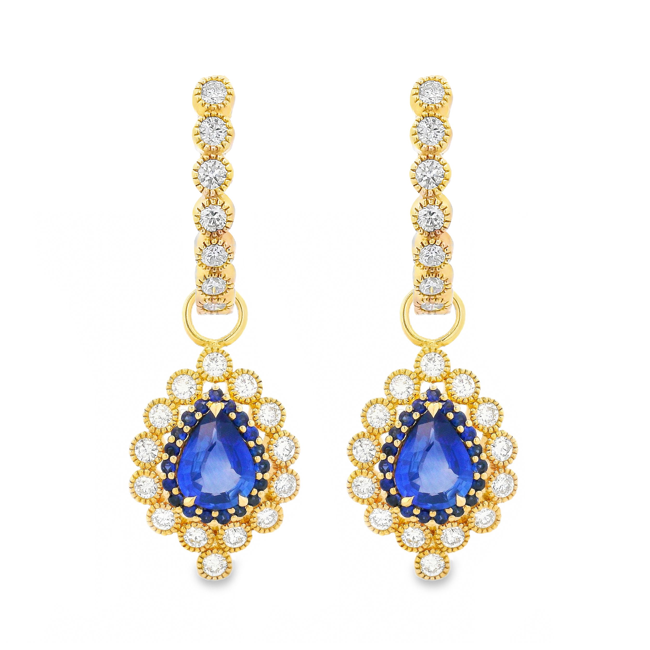 These 18K gold earring charms designed by Erica Courtney feature 2.35cts of richly colored pear-shaped blue sapphires, surrounded by a luminous halo of sapphires and diamonds. A striking balance of deep hue and refined brilliance. Hoops sold separately.-18k Yellow gold -Sapphire, 2.35cts -Diamond, F-G/VS 0.88ctsItem# 809-2000097 Blue Velvet Earring Charm