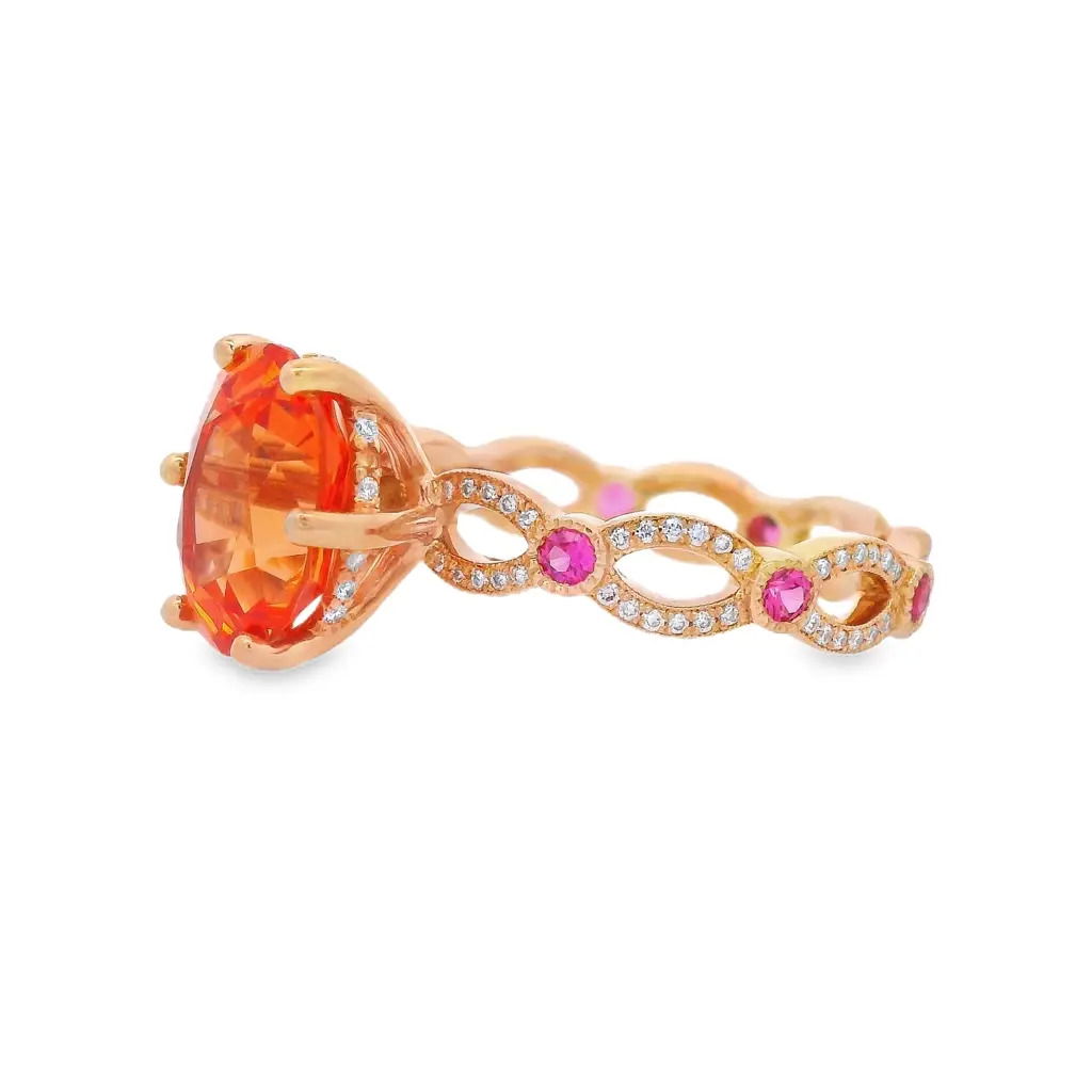 Vivid and eye-catching, this 18K yellow gold ring features a 3.8-carat oval-shaped mandarin garnet with fiery orange brilliance. Accented by 0.26 carats of pink spinel and 0.22 carats of round diamonds, it’s a striking blend of bold color and refined sparkle.-18k Yellow gold-Mandarin garnet, 3.80ct-Pink spinel, 0.26cts-Diamonds, F-G/VS 0.22cts-Size 7Item# 200-2000149 Annalise Ring
