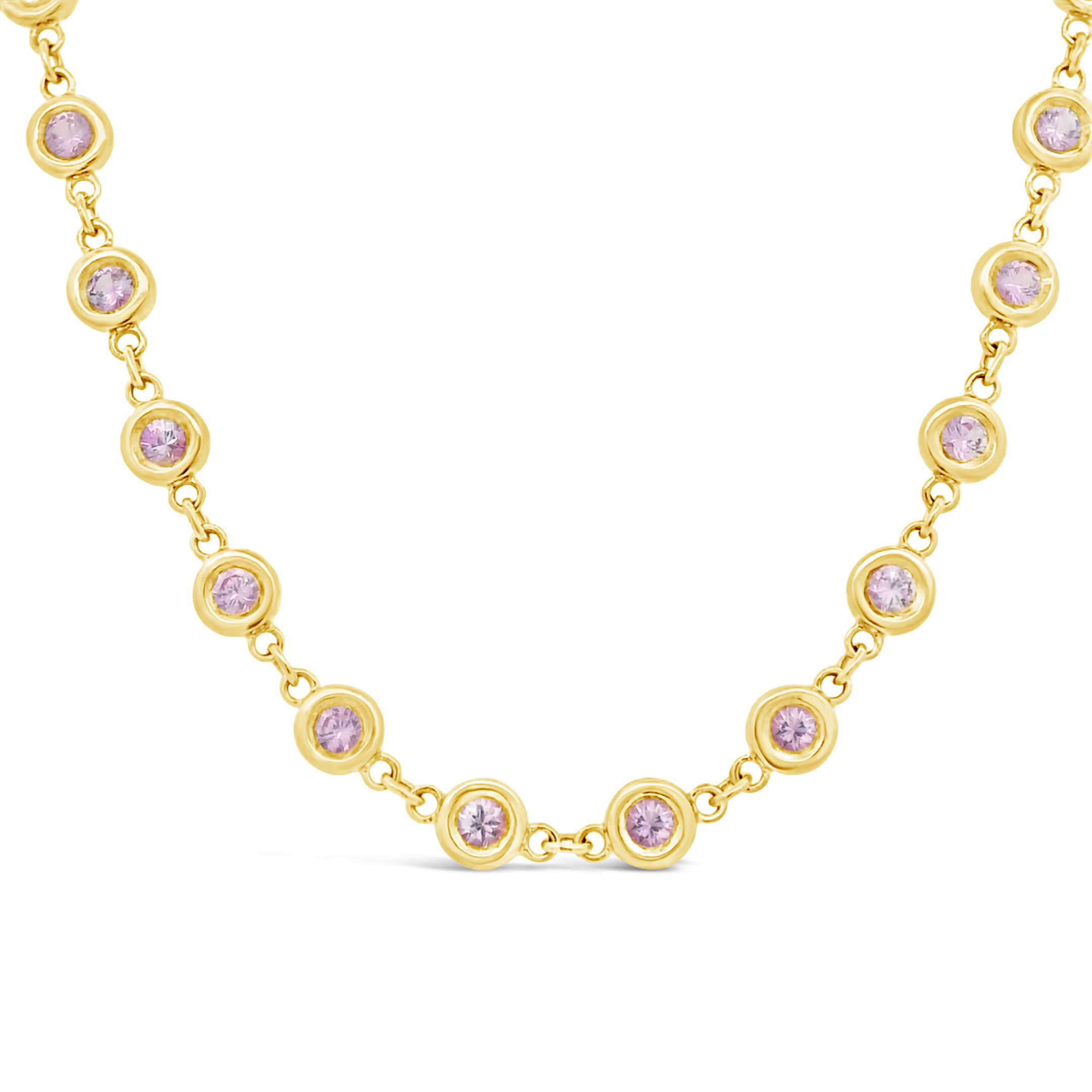 Crafted in lustrous 18k yellow gold, this necklace showcases 6.81cts of vibrant pink sapphires in secure bezel settings. The smooth design emphasizes the sapphires’ rich color and brilliance, making it a versatile piece that adds subtle sophistication to any outfit.Pendants sold separately. -18k Yellow gold-Pink sapphire, 6.81cts -Diamond, F-G/VS 0.25cts-Length 18" Item# 235-2000034 Pink Pulse Necklace