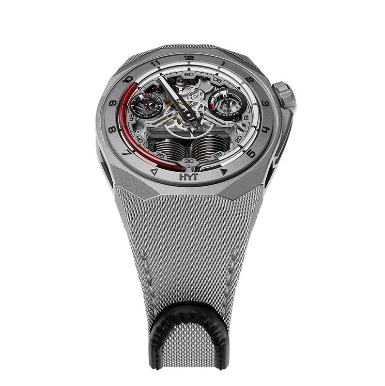The HYT S1 in Bead-Blasted Titanium offers a peek into the inner workings of the modern movement behind HYT’s signature fluidic hours system. This skeleton watch delivers a fascinating punch of futuristic aesthetics, coupled with tradition Swiss mechanical watchmaking.Retrograde Fluidic Hours SystemWatch S1 Titanium DLC (diamond-like coating) Black, Blue Fluid 5 ATMCase: Black coated & Natural titaniumMovement: mechanical hand-wound, 41 jewelsStrap: Black rubberBuckle: Natural titanium pin buckleDiameter: 45.30mmPower Reserve: 72 HoursWater Resistance: 50 Meters S1 Bead-Blasted Red Fluid