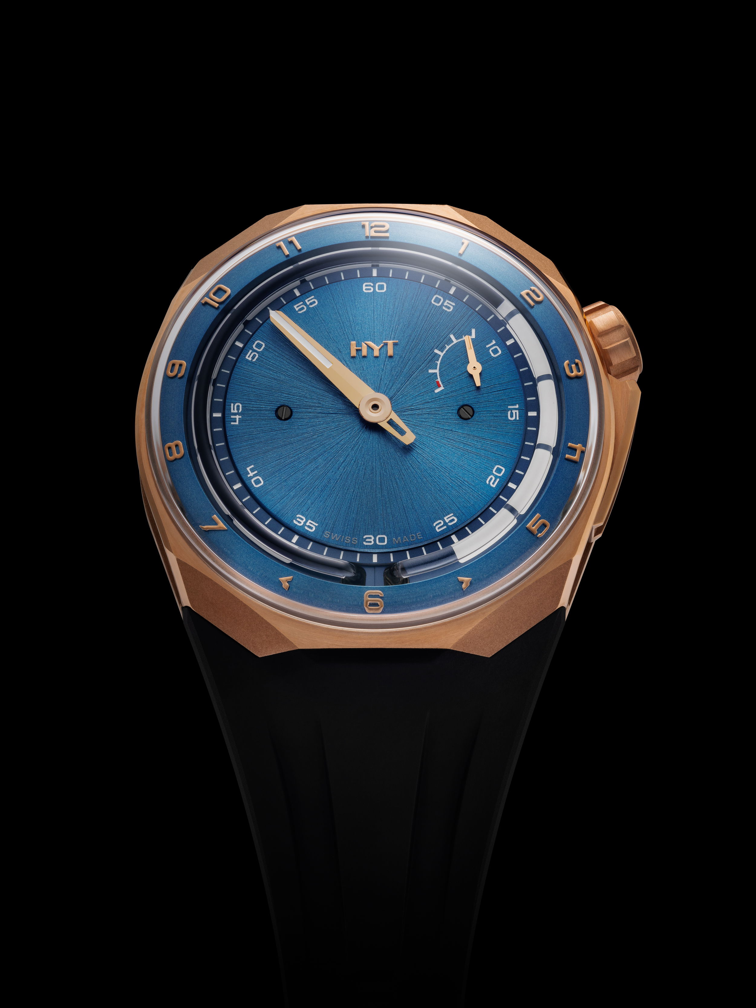The HYT T1 5N Gold & Titanium Deep Blue is a bold synthesis of avant-garde design and traditional Swiss mechanical craftsmanship. Merging noble materials with futuristic aesthetics, this timepiece captures the essence of HYT’s fluidic timekeeping philosophy in an elevated, modern form.Retrograde Fluidic Hours SystemHYT T1 5N Gold & Titanium Deep Blue 5 ATMCase: 18k Satin Finished Red Gold & Black PVD Coated Titanium Movement: mechanical hand-wound, 41 jewels. 72 Hour Power ReserveWidth: 45.30 mmLength: 46.30 mmThickness: 17.20 mmWater-resistant: 50 metresStrap: Blue rubberBuckle: Black coated titanium pin buckle T1 Titanium Deep Blue