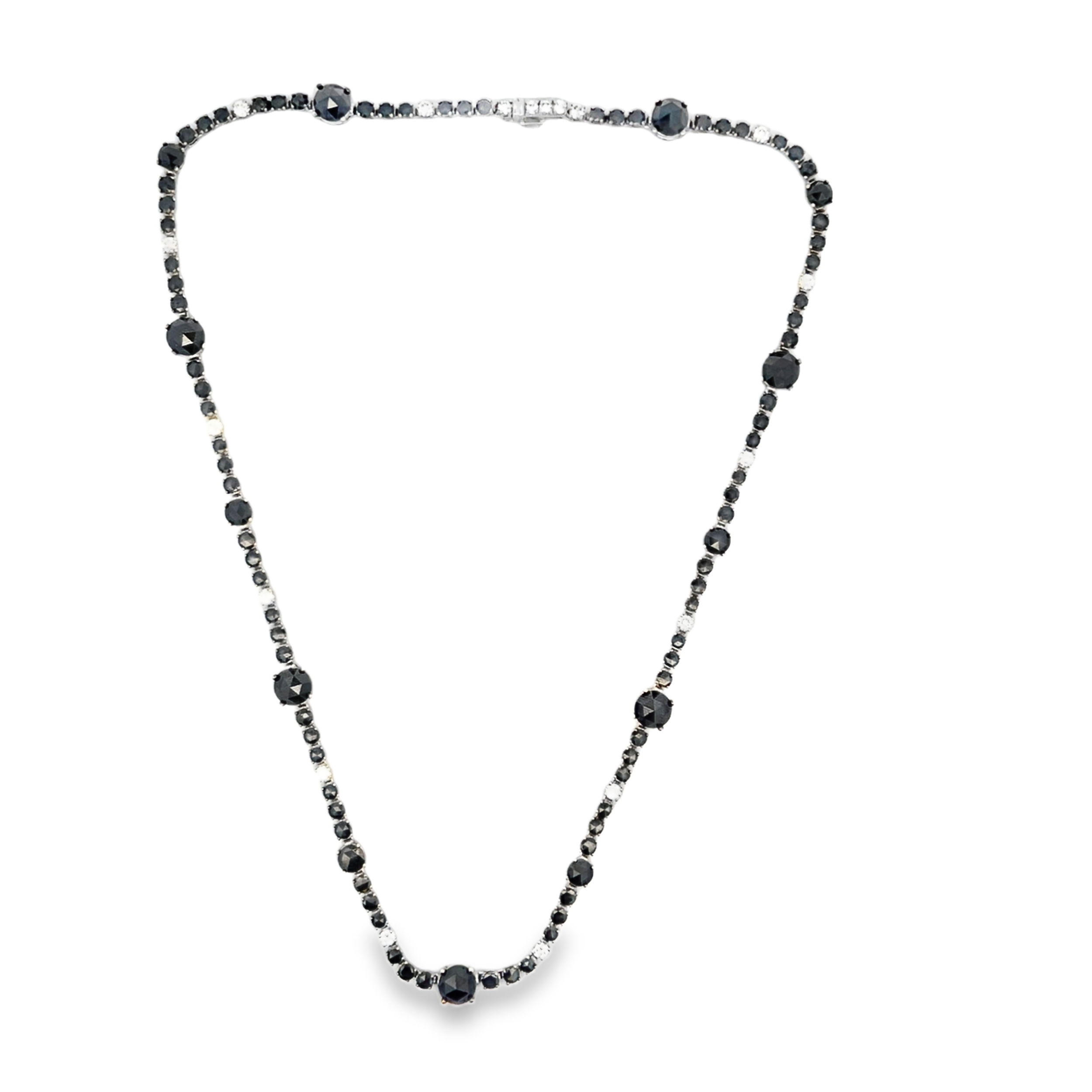 Norman Covan's 16" Rose-Cut Diamond Line Necklace features luminous white diamonds and bold black diamonds, artfully arranged in a striking rhythm of contrast and light. Each rose-cut stone is hand-set to highlight its vintage charm and natural brilliance, creating a timeless piece with modern edge.-18k White gold-Oxidized silver-Diamonds, 4.38cts-Black diamonds, 0.9cts-Length 16"Item# 165-2000063 Black and White Diamond Line Necklace