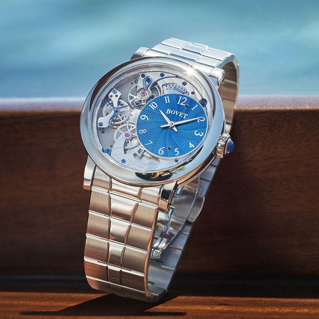 Recital 12 with Turquoise Dial. Bovet unveils a timepiece that comes on a bracelet and is designed to be a constant companion. All in titanium, the Recital is light, ergonomic, while at the same time focusing on high horology.Key Features:Case: Off-centered turquoise guilloche dial displaying hours and minutes. Indication of the seconds at the front and back with patented co-axial systemDial: Off-centered turquoise guilloche dial displaying hours and minutes. Movement: Hand wound mechanical Haute Horologie movementCaliber: 15BMDR12C2Complications: Power reserve indicatorRhodium-plated bridges with circular Cotes de Geneve patternWeight of timepiece: 75gr Recital 12