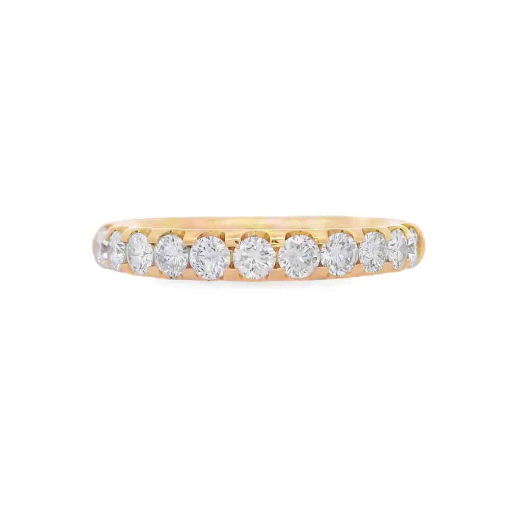 Bold brilliance with timeless appeal. This 1/2 way band is handcrafted in radiant 18K yellow gold and showcases U-prong set round brilliant cut diamonds—elevated to catch light from every angle. The open setting maximizes sparkle while maintaining a sleek, modern profile. A striking piece for stacking, celebrating, or simply owning your shine.18k Yellow gold-Round diamonds, 0.69cts-Size 6.5, Contact for sizing optionsItem# 110-2000055 U-Prong 1/2 Way Band