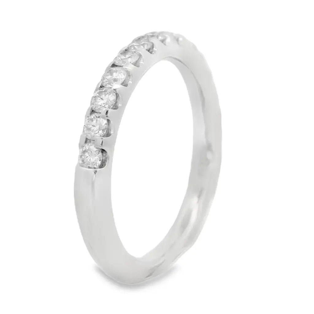 Bold brilliance with timeless appeal. This 1/2 way band is handcrafted in radiant 18K white gold and showcases U-prong set round brilliant cut diamonds—elevated to catch light from every angle. The open setting maximizes sparkle while maintaining a sleek, modern profile. A striking piece for stacking, celebrating, or simply owning your shine.18k White gold-Round diamonds, 0.49cts-Size 6.5, Contact for sizing optionsItem# 110-2000056 U-Prong 1/2 Way Band