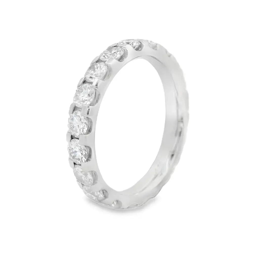 Bold brilliance with timeless appeal. This eternity band is handcrafted in radiant 18K white gold and showcases a continuous row of U-prong set diamonds—elevated to catch light from every angle. The open setting maximizes sparkle while maintaining a sleek, modern profile. A striking piece for stacking, celebrating, or simply owning your shine.18k White gold-Round diamonds, 1.98cts-Size 6.5, Contact for sizing optionsItem# 110-2000059 U-Prong Eternity Band