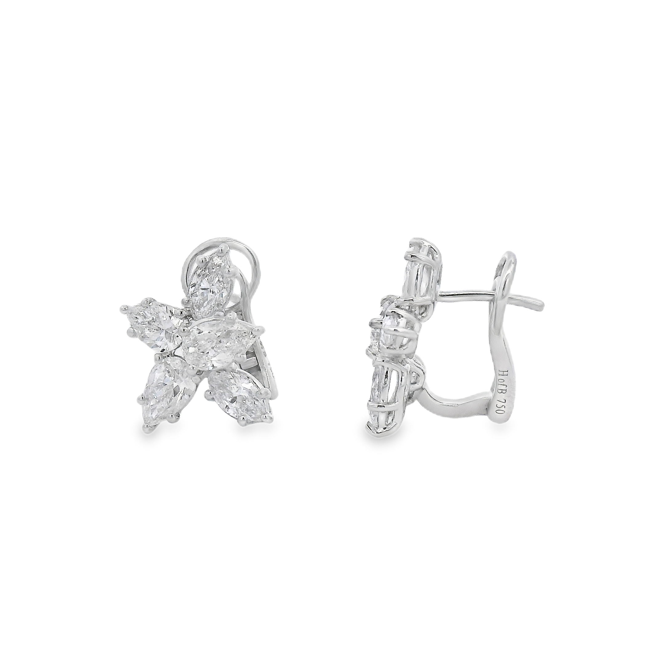 These elegant butterfly-shaped earrings are crafted with precision, featuring a dazzling arrangement of sparkling stones that catch the light beautifully. Perfect for adding a touch of elegance to any outfit, they are a must-have accessory for special occasions or everyday wear-18k White gold-Marquise and Pear shaped diamonds, 0.76ctsItem# 150-2000122 Butterfly Shaped Earrings