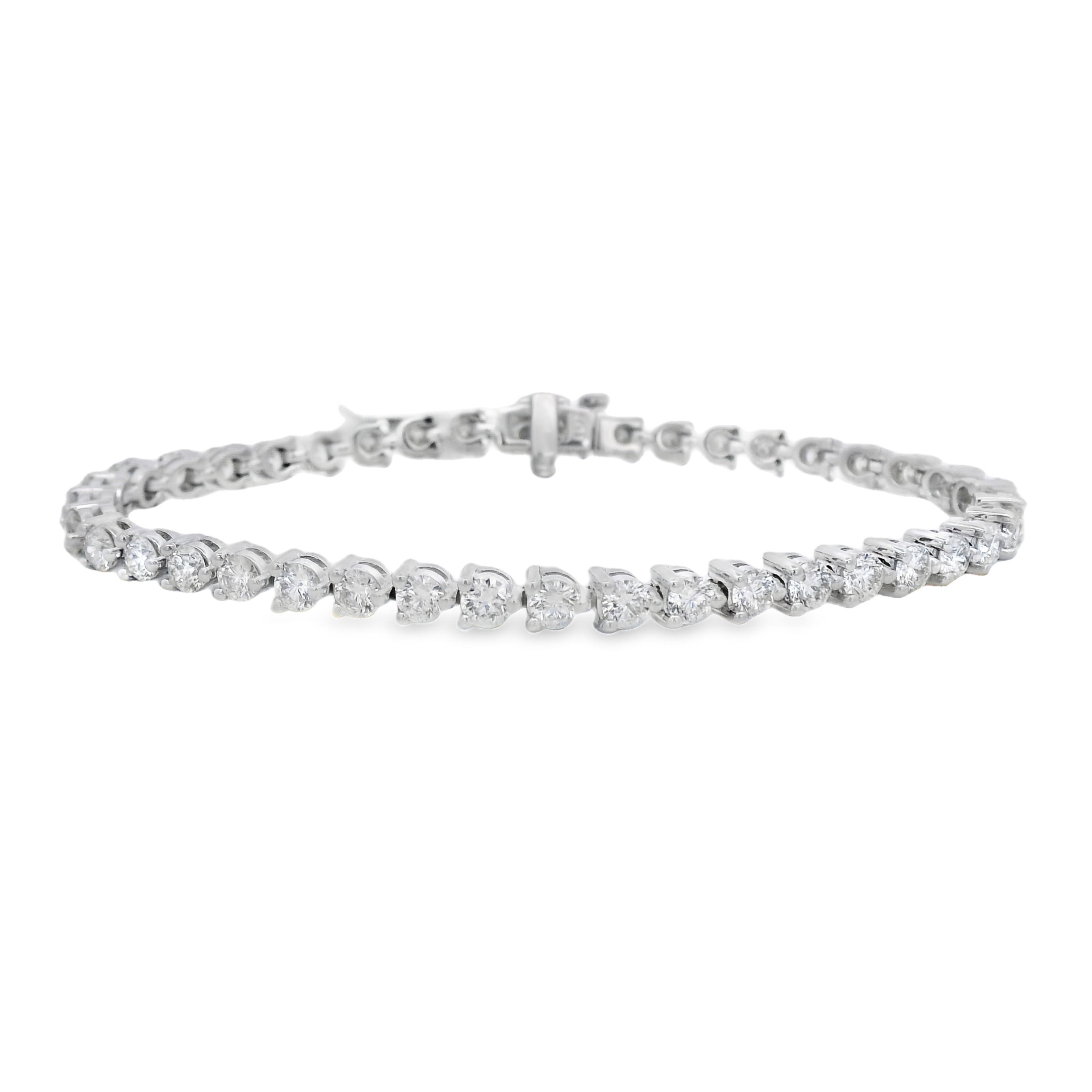 Set in 14k white gold, this classic bracelet sparkles with 5.48 carats of round brilliant cut diamonds. A refined, timeless piece made to shine every day.-14k White gold-Diamonds, 5.48ctsItem# 170-2000056 Diamond Tennis Bracelet
