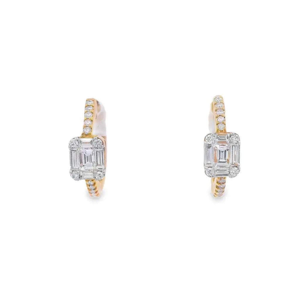 Discover the perfect blend of elegance and sophistication with these stunning 19K yellow gold diamond hoop earrings. Crafted with precision, each earring features a radiant emerald-cut diamond surrounded by sparkling smaller stones, creating a captivating look that enhances any outfit. Ideal for both special occasions and everyday wear, these earrings are a must-have addition to your jewelry collection. -18k Yellow gold-Round and Baguette diamonds, 0.50ctsItem# 150-2000124 Baguette Diamond Hoops