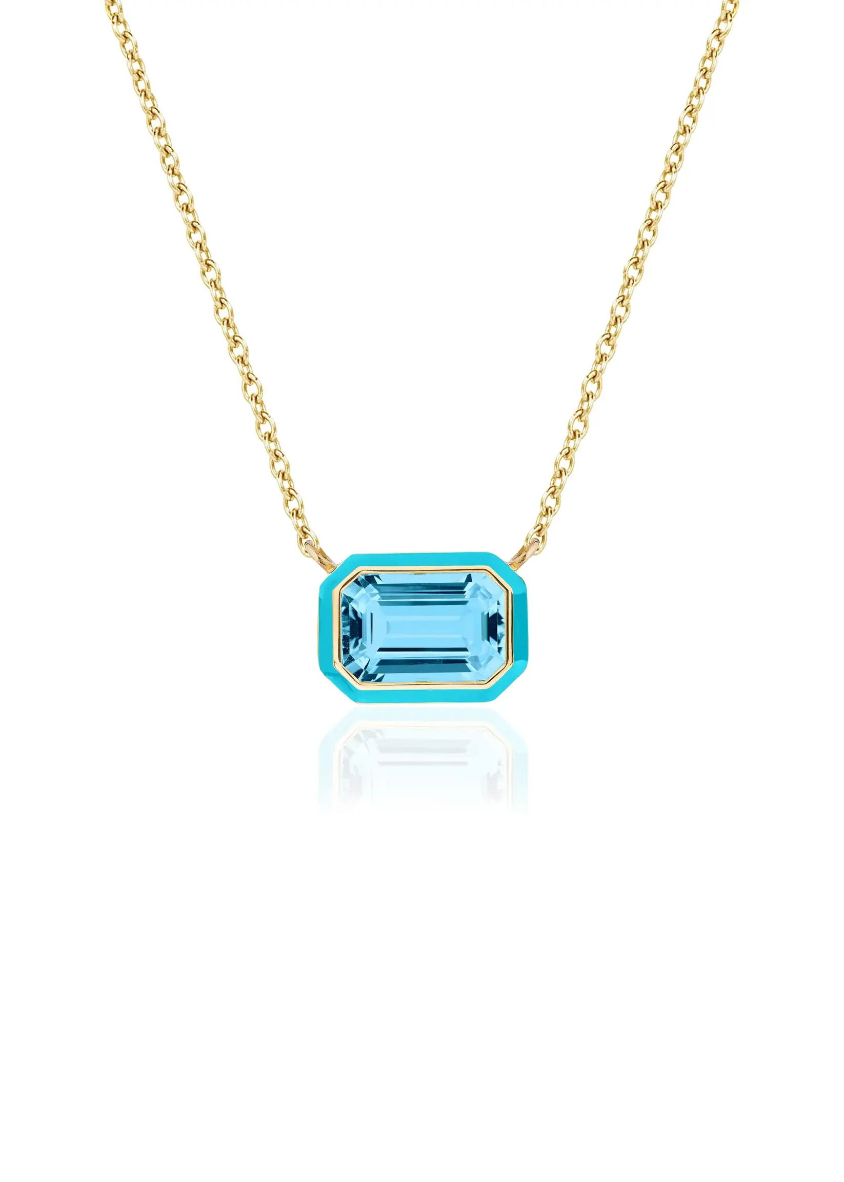 The Queen East-West Pendant reimagines elegance in a playful silhouette - an emerald-cut centerpiece framed in vividenamel, suspended in a sleek horizontal setting.18k Yellow gold-Sky blue topaz, 4.68ctsItem# 235-2000037 'Queen' Blue Topaz Necklace