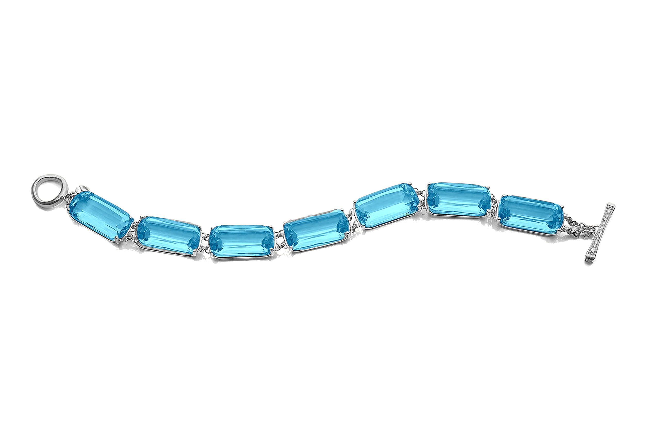 The vibrant blue hues contrast perfectly with the warm gold setting, making this bracelet a bold yet timeless statement piece—ideal for both everyday glamour and special occasions. Secure it around your wrist for an instant touch of sophistication and radiant allure.-18k Yellow gold-Blue topaz, 105.4cts-Diamonds, 0.46ctsItem# 240-2000033 'Gossip' Blue Topaz Line Bracelet