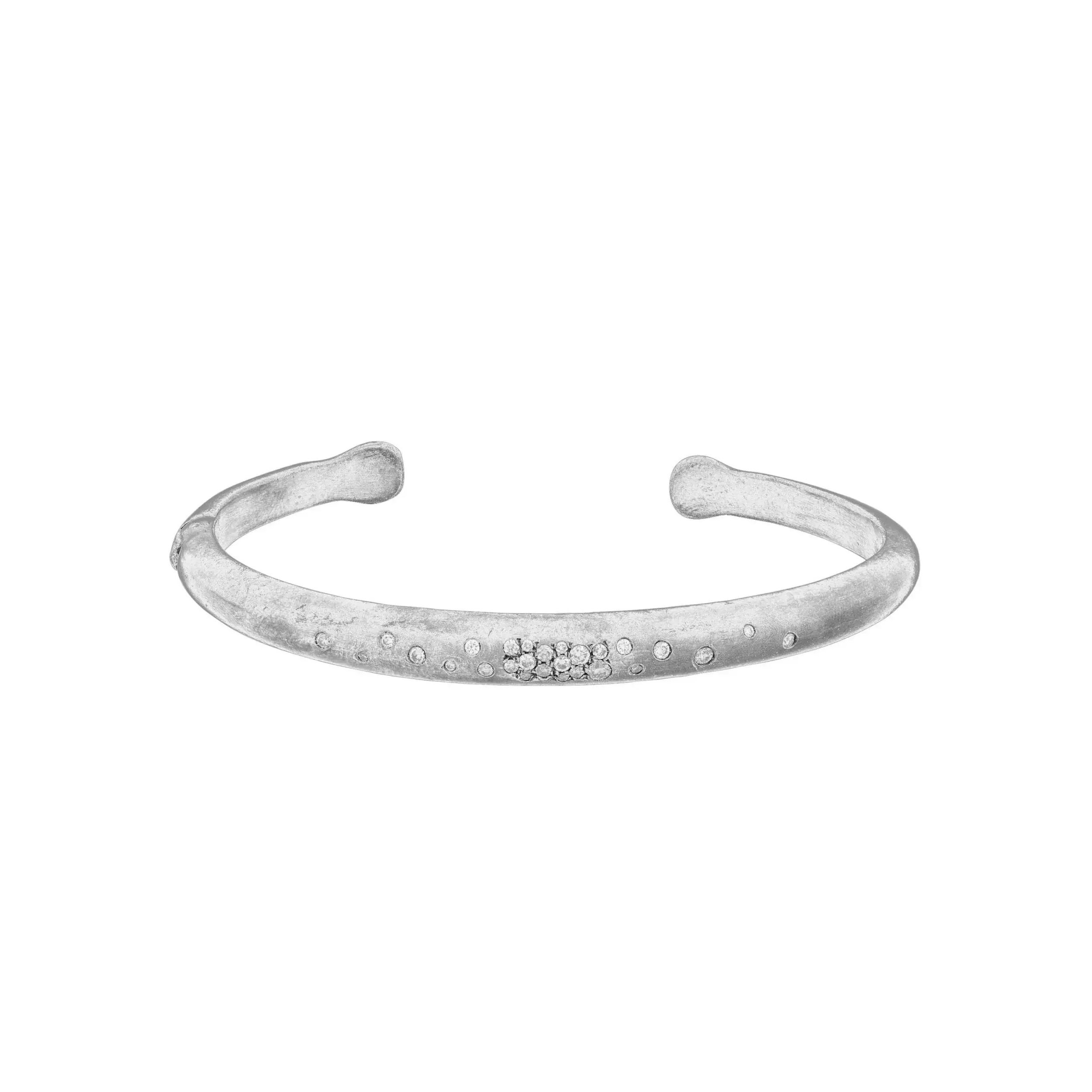 Sleek and expressive, the “Boogie Line” bracelet is crafted in polished sterling silver and accented with shimmering diamonds. Its clean lines and subtle sparkle make it a versatile statement—effortlessly modern, endlessly wearable.-Sterling silver-Diamonds, 0.25ctsItem# 808-2000304 Boogie Line Cuff Bracelet