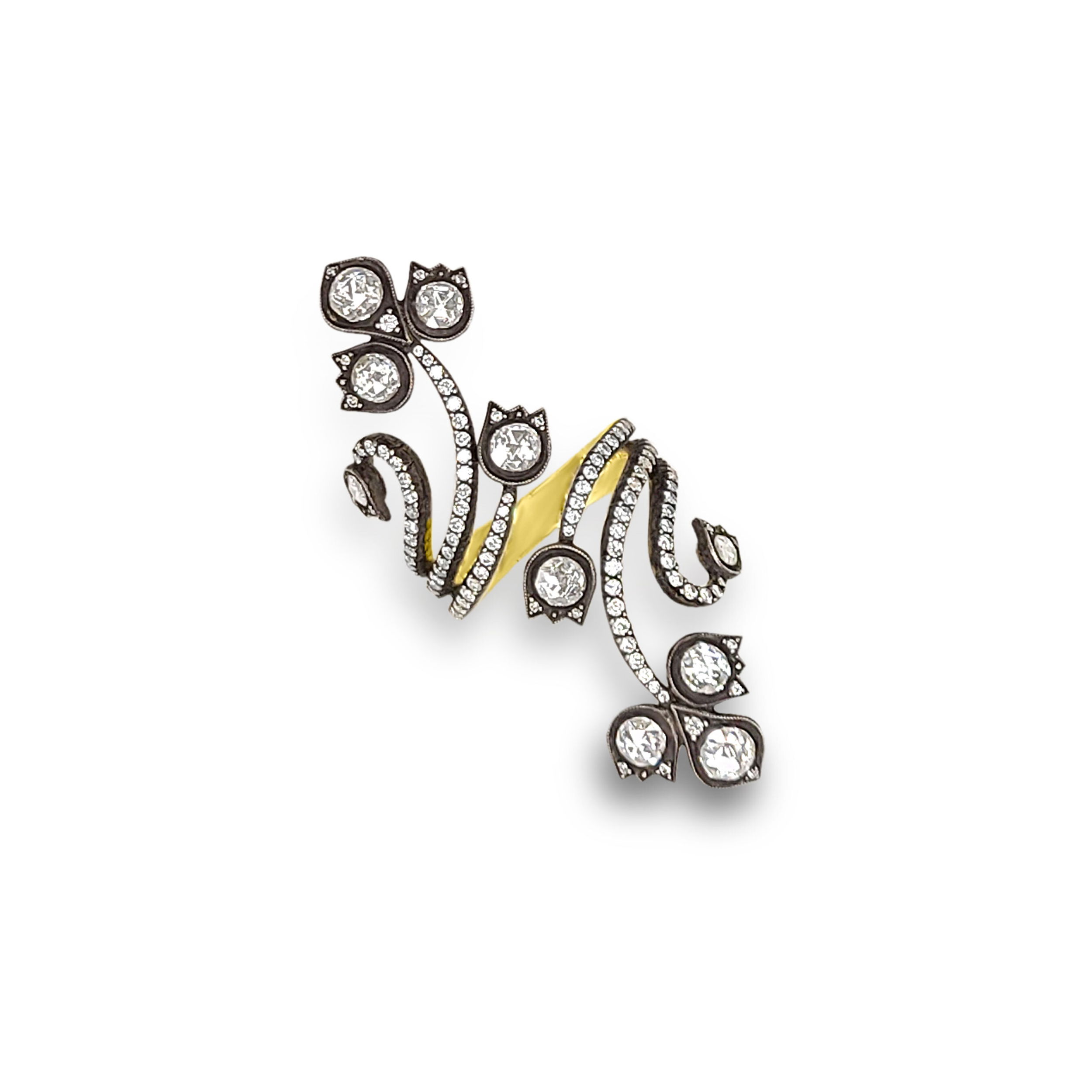 This ring pairs 18k yellow gold and oxidized silver with sparkling diamonds for a bold, contrast-rich design. Norman Covan's Rose Cut Collection is a rare, one-of-a-kind offering of vintage stones hand-set into heirloom-quality pieces that blend historic craftsmanship with modern elegance.-18k Yellow gold-Oxidized silver-Diamonds, 2.70cts-Contact for sizing optionsItem# 804-2000328 Bypass Diamond Rose Cut Ring