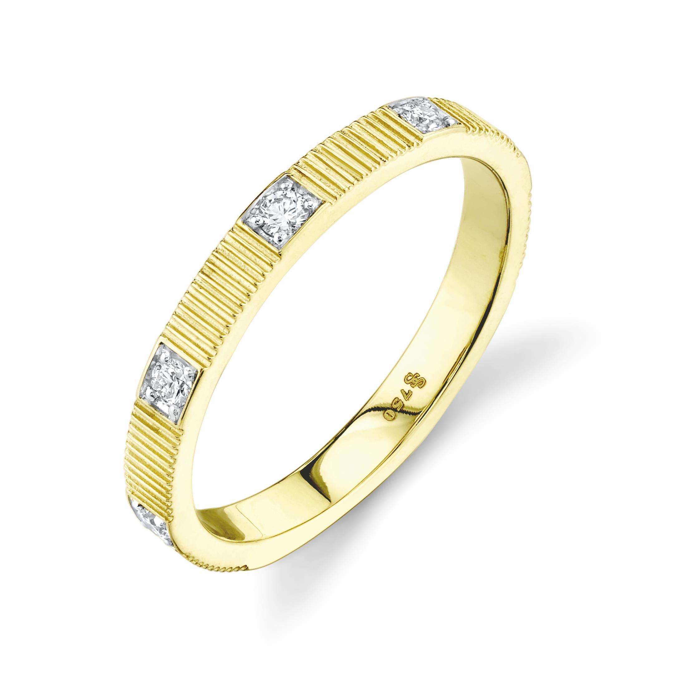 The signature strié texture adds an artisanal touch, offering dynamic contrast and tactile intrigue. Perfect for wearing solo, pairing with an engagement ring, or layering with other bands, this piece is a versatile essential for refined style.18k Yellow gold-Round diamonds, 0.18ctsItem# 804-2000341 Diamond Stacker Band