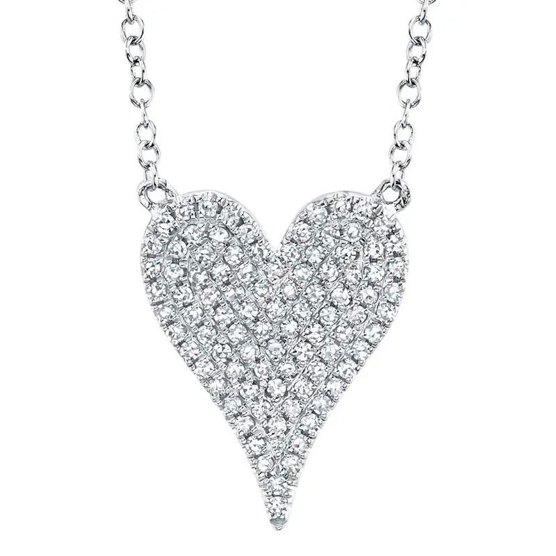 All Shy Creation diamonds are natural and hand-selected. All stones are unique and hand set. As a result, you can expect slight variations in the shade, hue, tint of the color stones and stone count.14k White gold-Round diamonds, 0.21cts-Dimensions, 0.55"L / 0.40"W-Chain length, 15"-18" on adjustable chainItem# 807-2000404 Diamond Pave Heart Necklace