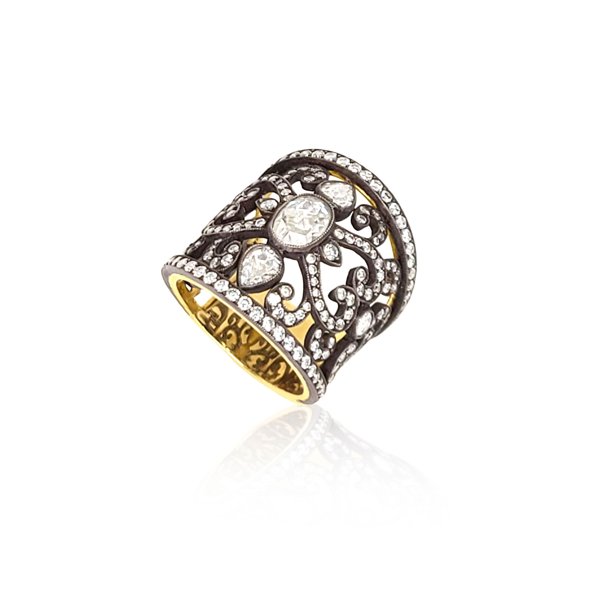 Bold yet refined, this cigar band ring features an oval rose-cut diamond, merging vintage charm with contemporary statement style. Norman Covan's Rose Cut Collection is a rare, one-of-a-kind offering of vintage stones hand-set into heirloom-quality pieces that blend historic craftsmanship with modern elegance.-18k Yellow gold-Oxidized silver-Diamonds, 2.61cts-Contact for sizing options.Item# 804-2000352 Oval Rose Cut Diamond Cigar Band Ring