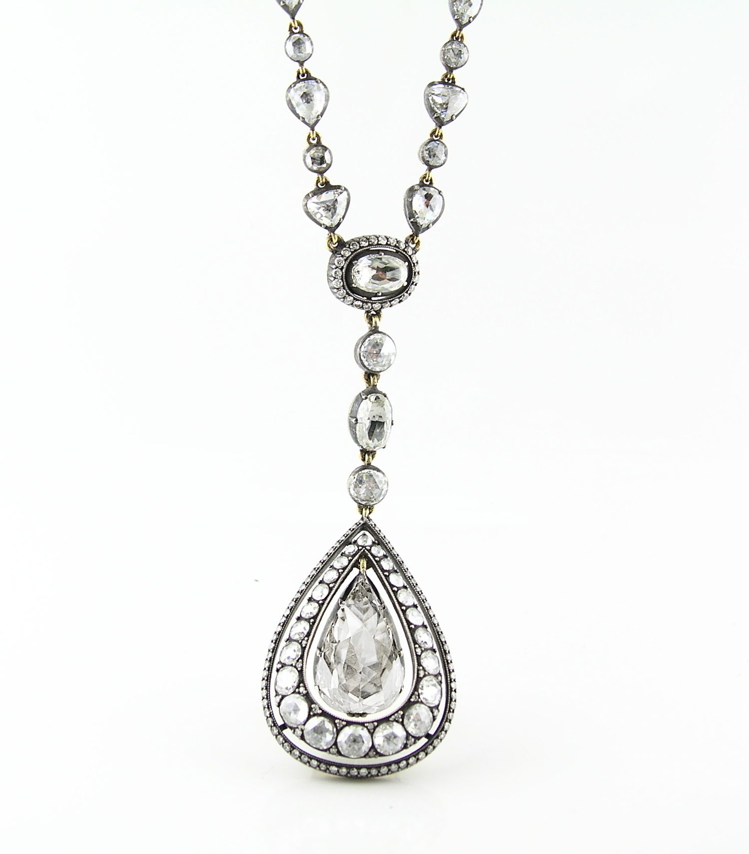 Norman Covan's 18KY & Oxidized Silver Pear Shaped Rose-Cut Diamond necklace showcases a rare and storied craftsmanship, reviving the centuries-old mirror-back setting mastered by only a select few artisans. Norman Covan's Rose Cut Collection is a rare, one-of-a-kind offering of vintage stones hand-set into heirloom-quality pieces that blend historic craftsmanship with modern elegance.-18k Yellow gold-Oxidized silver-Diamonds, 11.07ctsLength 17"Item# 804-2000407 Pear Rose Cut Necklace