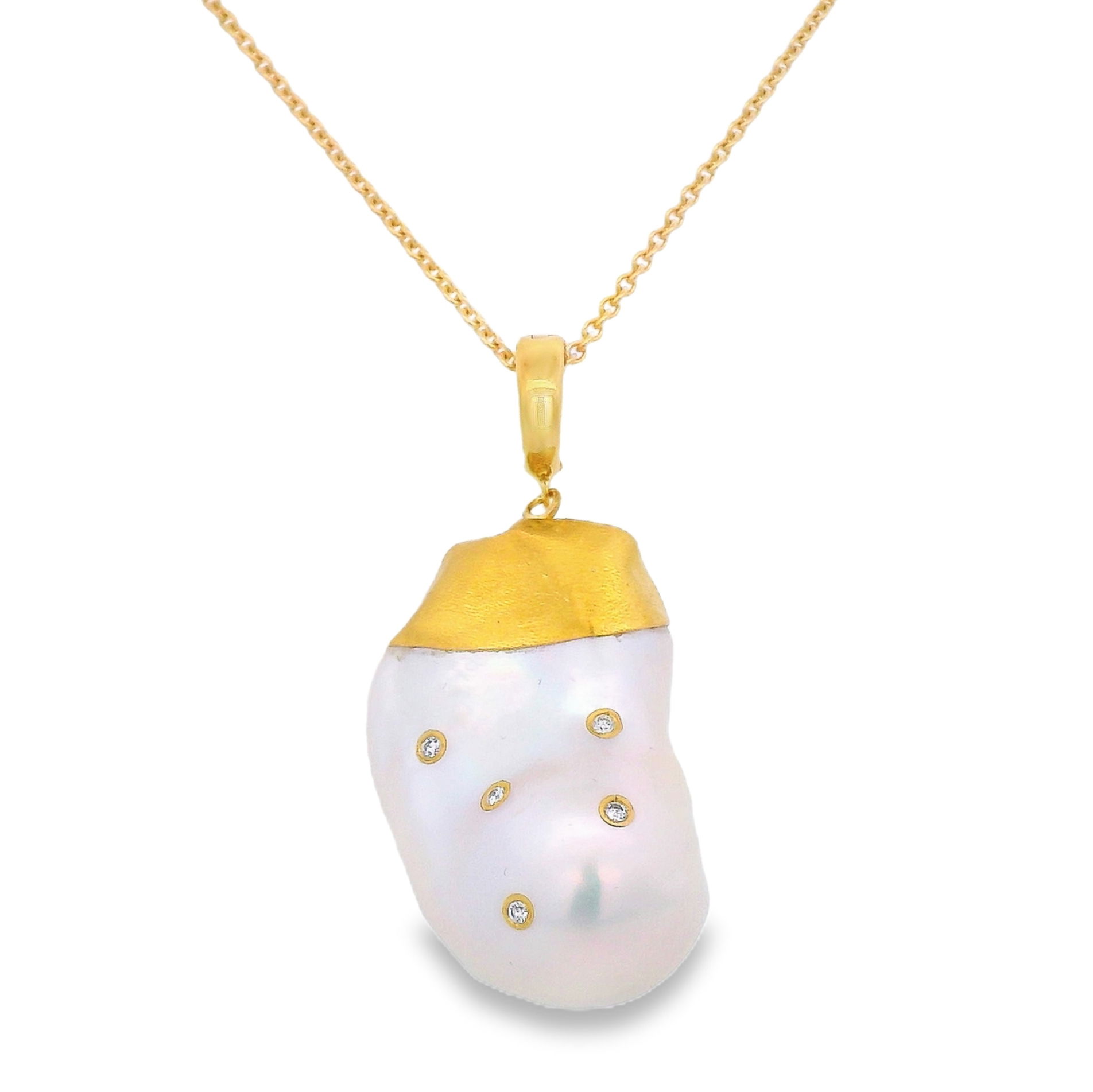 This glorious pearl pendant with diamonds would be a standout piece in anyones jewelry box. If you are a collector who values unique and beautiful jewelry, then this is the pendant for you! Chain sold separately. -24k and 14k Yellow gold-Pearl-Diamonds, 0.11ctsItem# ND-PD-00015 Gloria Pearl Pendant with Diamonds