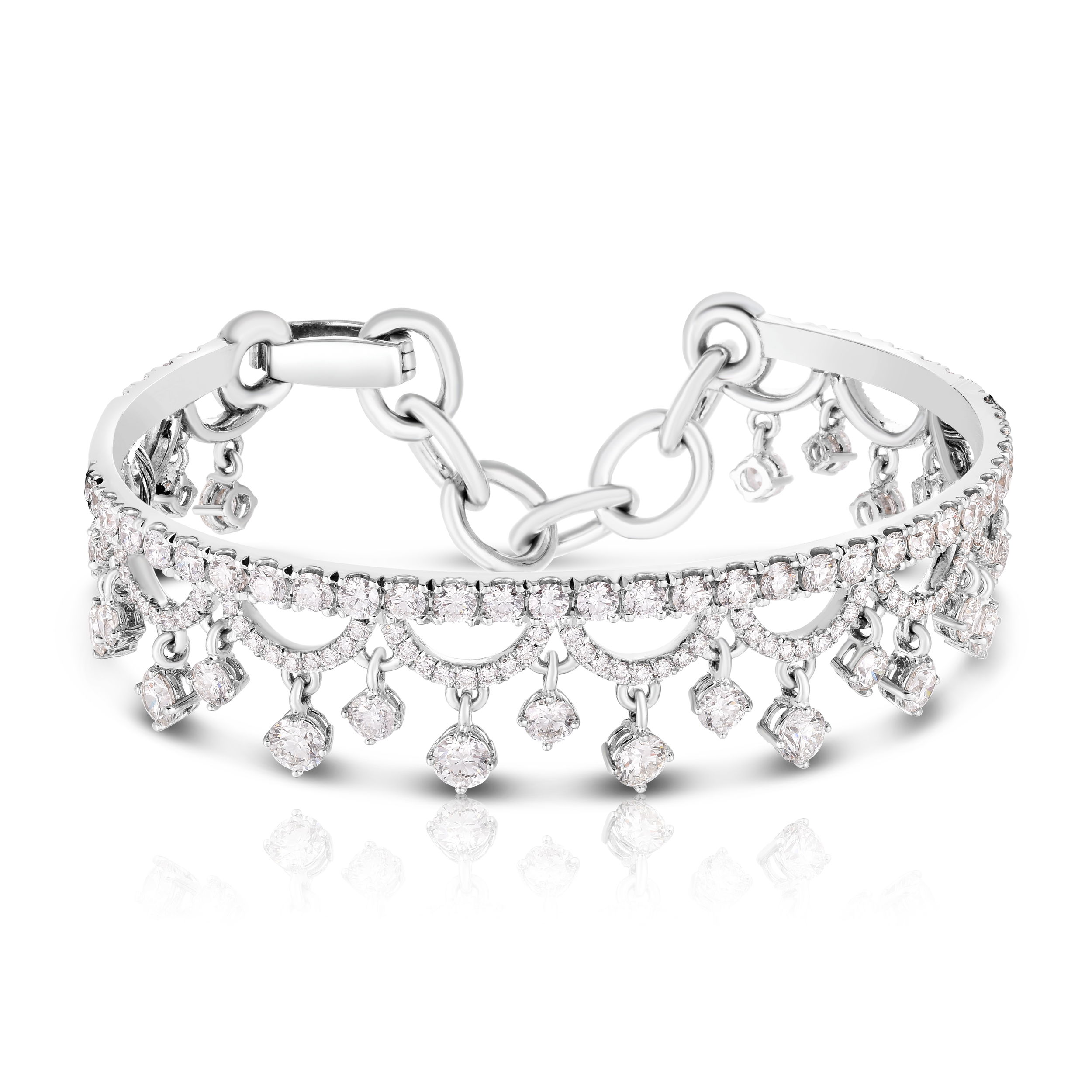 This breathtaking chandelier bracelet is meticulously crafted from rich 18k white gold, providing the perfect backdrop for a dazzling array of brilliant-cut diamonds. The intricate design features a cascading waterfall of shimmering stones, creating a truly opulent and eye-catching piece. Cicada atelier is located in the heart of the New York City jewelry district on 47th street, where each unique piece is meticulously handcrafted.-18k White gold-Diamonds, 8.51ctsItem# 808-2000327 Chandelier Bracelet