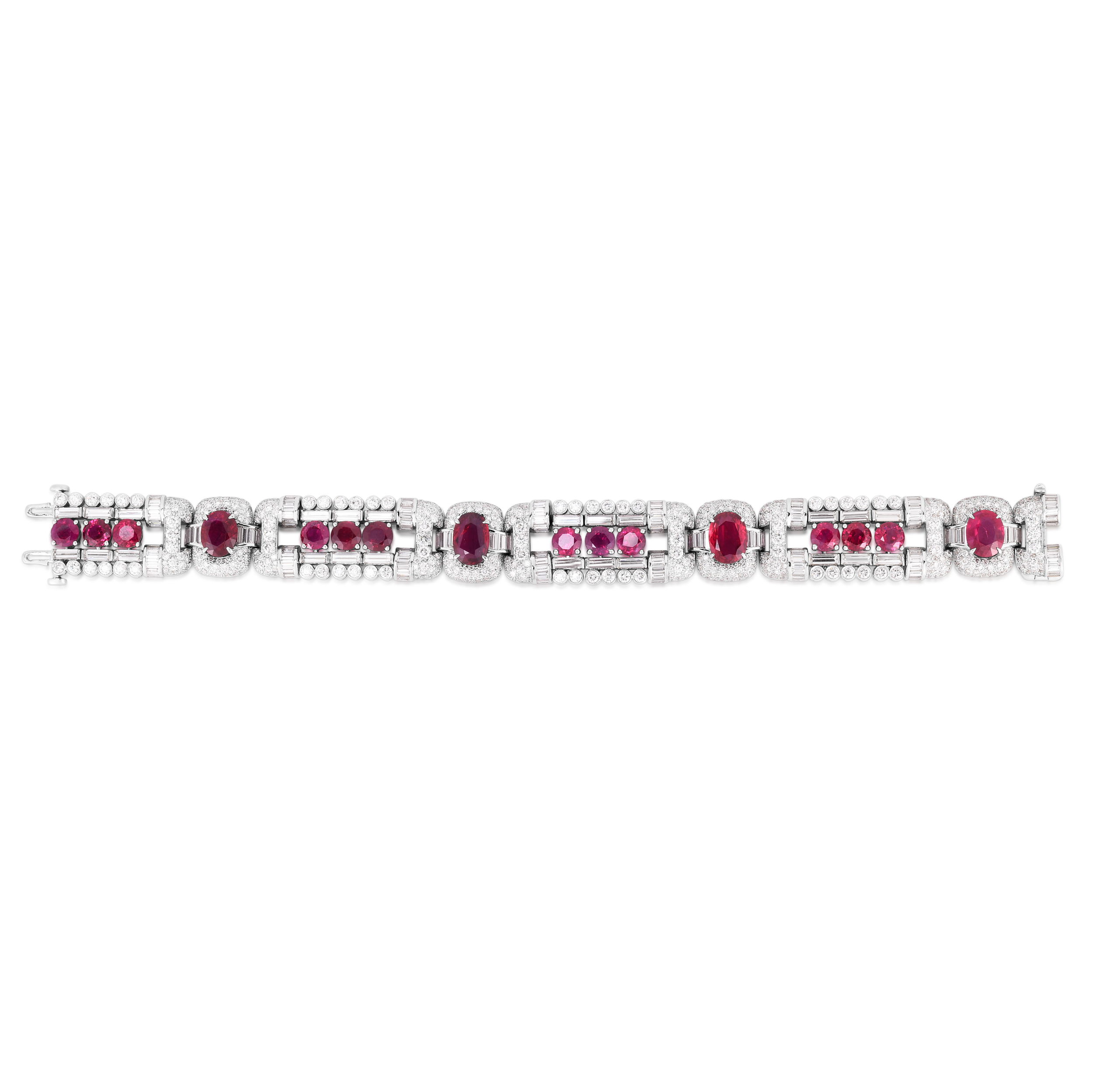 A dazzling one-of-a-kind bracelet featuring red rubies and a substantial amount of diamonds, all masterfully set in platinum. This one-of-a-kind piece is perfect for a special occasion and has a wonderful vintage feel to it. Cicada atelier is located in the heart of the New York City jewelry district on 47th street, where each unique piece is meticulously handcrafted.-Platinum -Oval and round rubies, 20.01cts-Round and baguette diamonds, 15.84cts-Stones are set in a mixture of prong, bezel and pave settings-Size 7item 808-2000239 Art Deco Ruby Bracelet