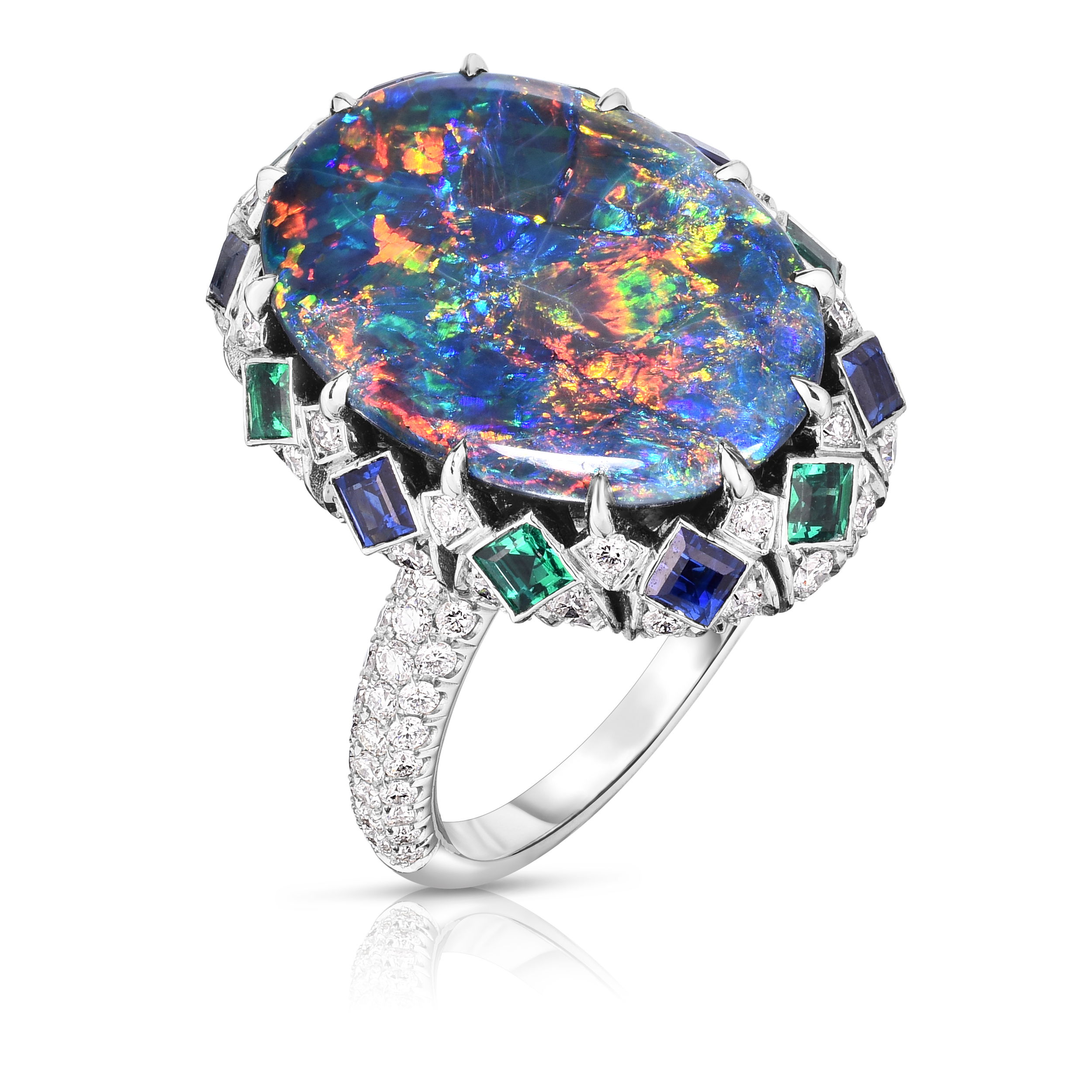 A symphony of color and brilliance, this ring features a captivating opal at its heart, encircled by sparkling diamonds and complemented by the deep hue of sapphire. Crafted in gleaming platinum, it's a wearable masterpiece that speaks to your individual style. Cicada atelier is located in the heart of the New York City jewelry district on 47th street, where each unique piece is meticulously handcrafted.-Platinum-Diamonds, 1.17cts-Opals, 5.95cts-Sapphires, 0.70cts-Emerald, 0.33ctsItem# 200-2000166 Glamour Ring