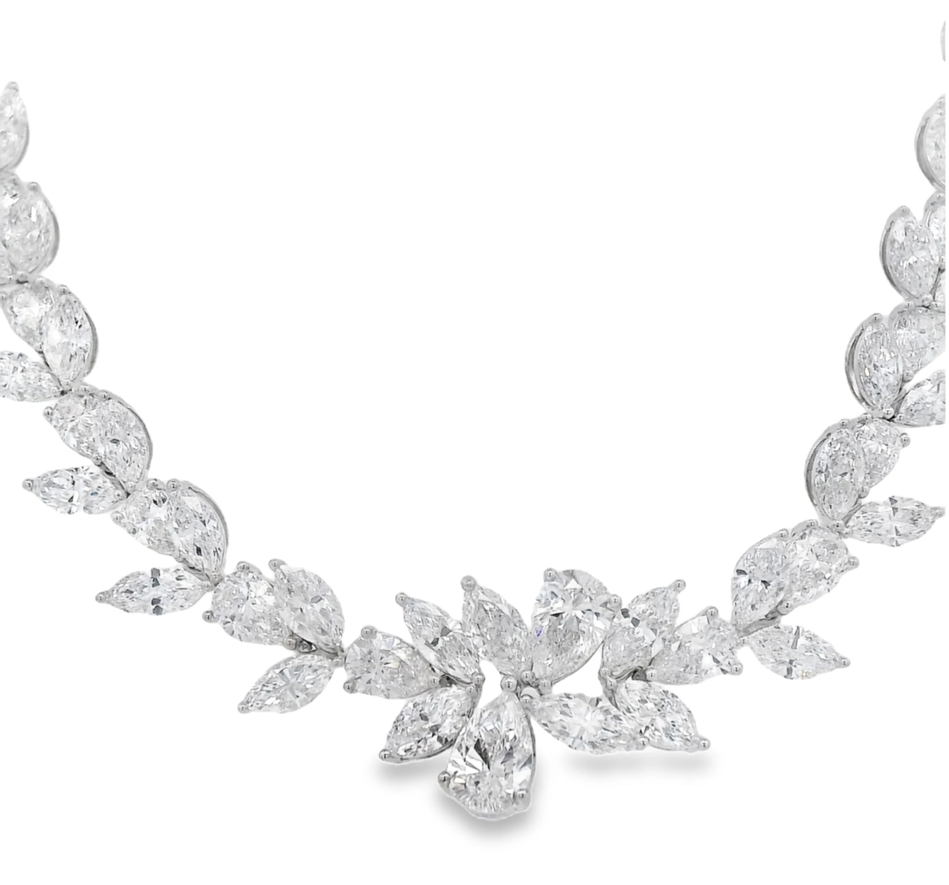 A breathtaking statement in 18k white gold, this necklace features meticulously arranged pear-shaped diamonds. Fluid and radiant, each stone catches the light like falling petals—pure elegance, redefined. Cicada atelier is located in the heart of the New York City jewelry district on 47th street, where each unique piece is meticulously handcrafted.-18k White gold-Pear-shaped diamonds, 28.40cts-Length 17"Item# 165-2000065 Riviera Leaf Necklace