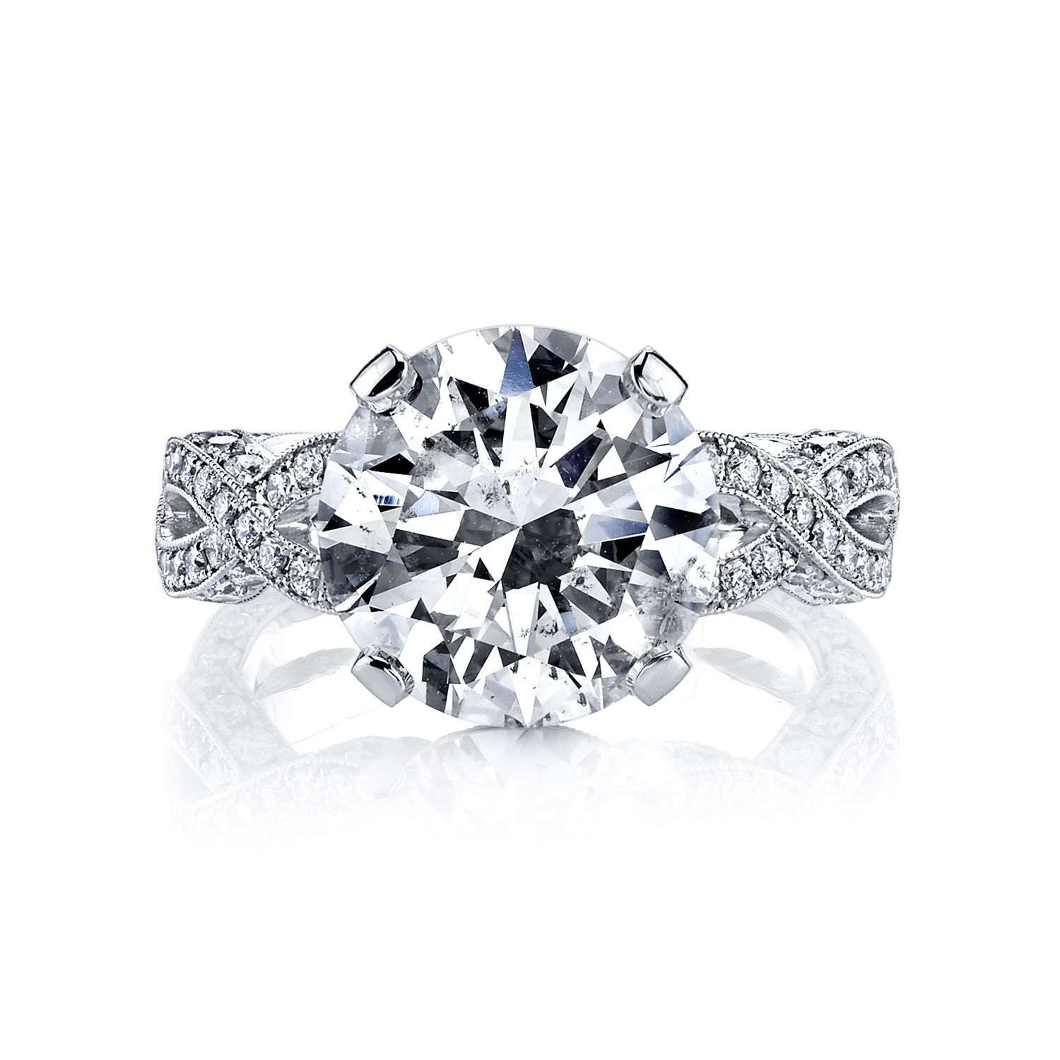 A love story in every curve. This enchanting engagement ring pairs a 5.13-carat round brilliant cut diamond with a flowing open twist shank in luminous platinum. The entwined design symbolizes two paths becoming one—elegant, eternal, and made to shine for a lifetime.-Platinum-Round diamond, 5.13ct-Round diamonds, 1.22cts-Size 6.5, contact for sizing optionsItem# 100-2000063 Open Twist Engagement Ring