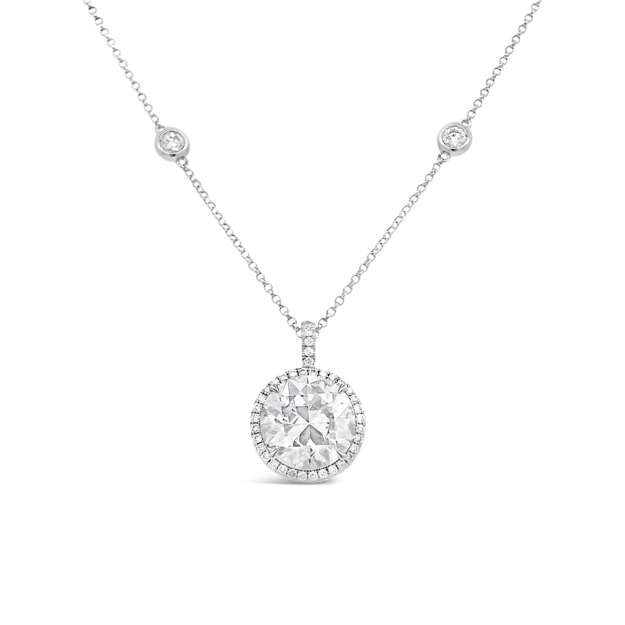 Elevate your elegance with this exquisite Round Diamond Necklace, featuring a dazzling solitaire diamond pendant gracefully suspended on a Diamonds-By-The-Yard chain. Each sparkling diamond is meticulously set along a delicate chain.-18k White gold-Round diamonds, 4.82cts, center stone, 4.11cts-Length, 18"Item# 165-2000067 Round Diamond Necklace on Diamonds-By-The-Yard Chain