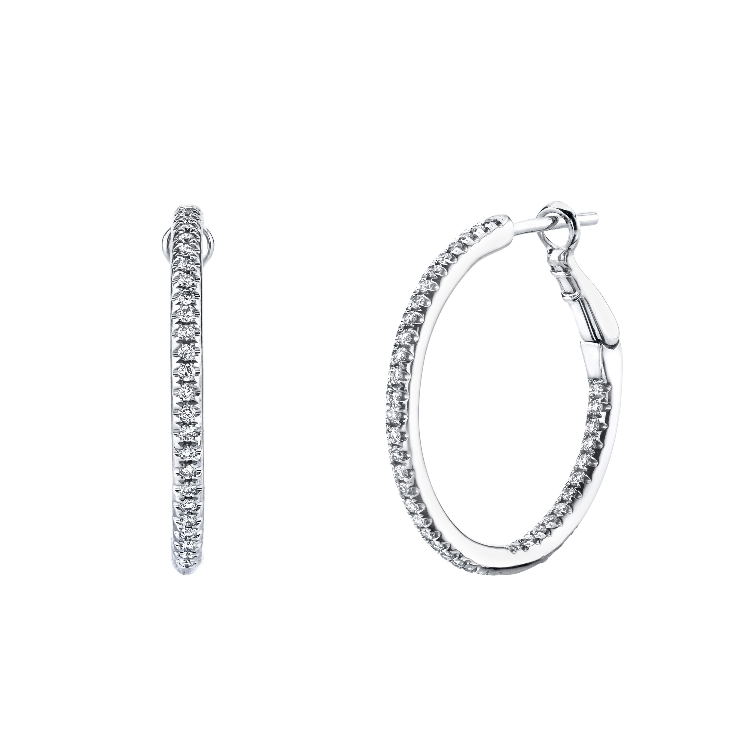 Their timeless design ensures a perfect accent for every occasion, seamlessly blending luxury with everyday wear. Indulge in the enduring beauty of diamonds and the refined allure of white gold with these exquisite hoop earrings.-18k White gold-Round diamonds, 0.40ctsItem# 150-2000132 Diamond Hoop Earrings