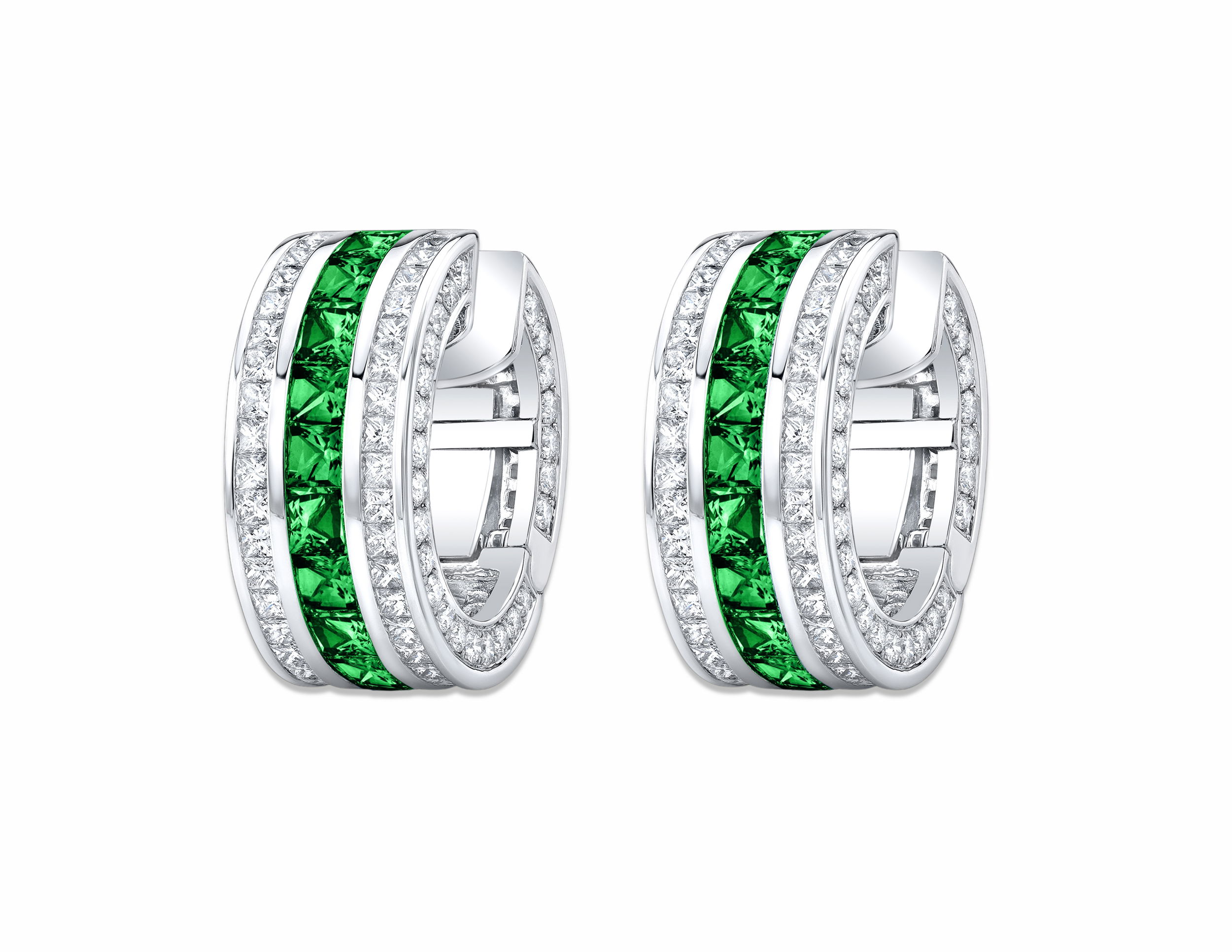 Crafted in platinum, these clutch-style earrings showcase vivid emeralds beautifully complemented by sparkling diamonds. Sleek and sophisticated, they offer a perfect blend of classic elegance and contemporary style.-Platinum-Emeralds, 5.14cts-Diamonds, 6.24ctsItem# 210-2000093 Emerald and Diamond French Cut Masterpiece Clutch Earrings