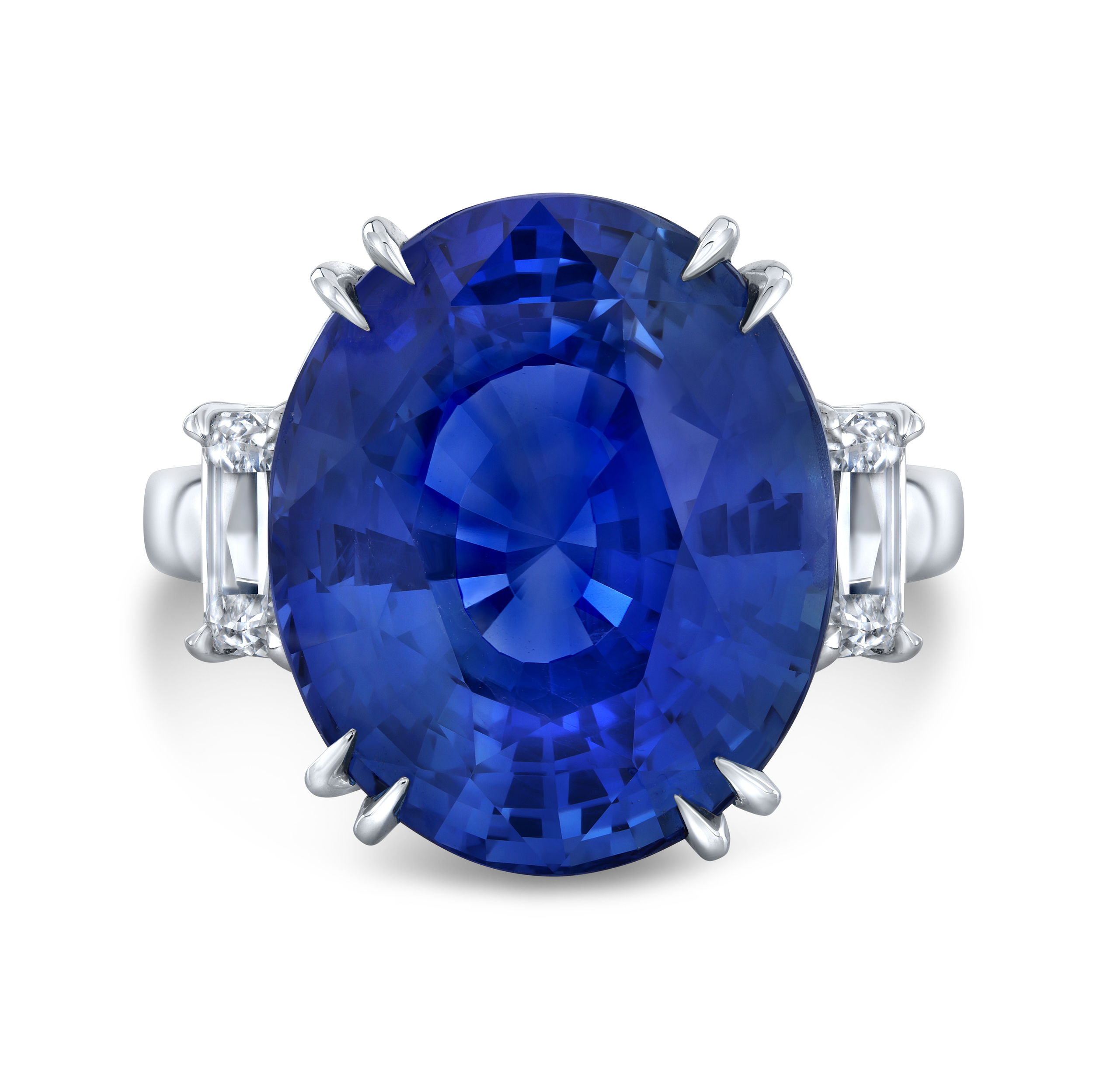 Crafted in platinum, this exceptional ring by Robert Procop showcases a stunning oval blue sapphire at its center—rich in color and timeless in elegance. Flanked by two Ashoka cut diamonds, the design balances bold brilliance with refined sophistication.-Platinum -Blue sapphire, 23.05ct-Diamonds, 1.81ctsItem# 200-2000171 Oval Blue Sapphire Ring