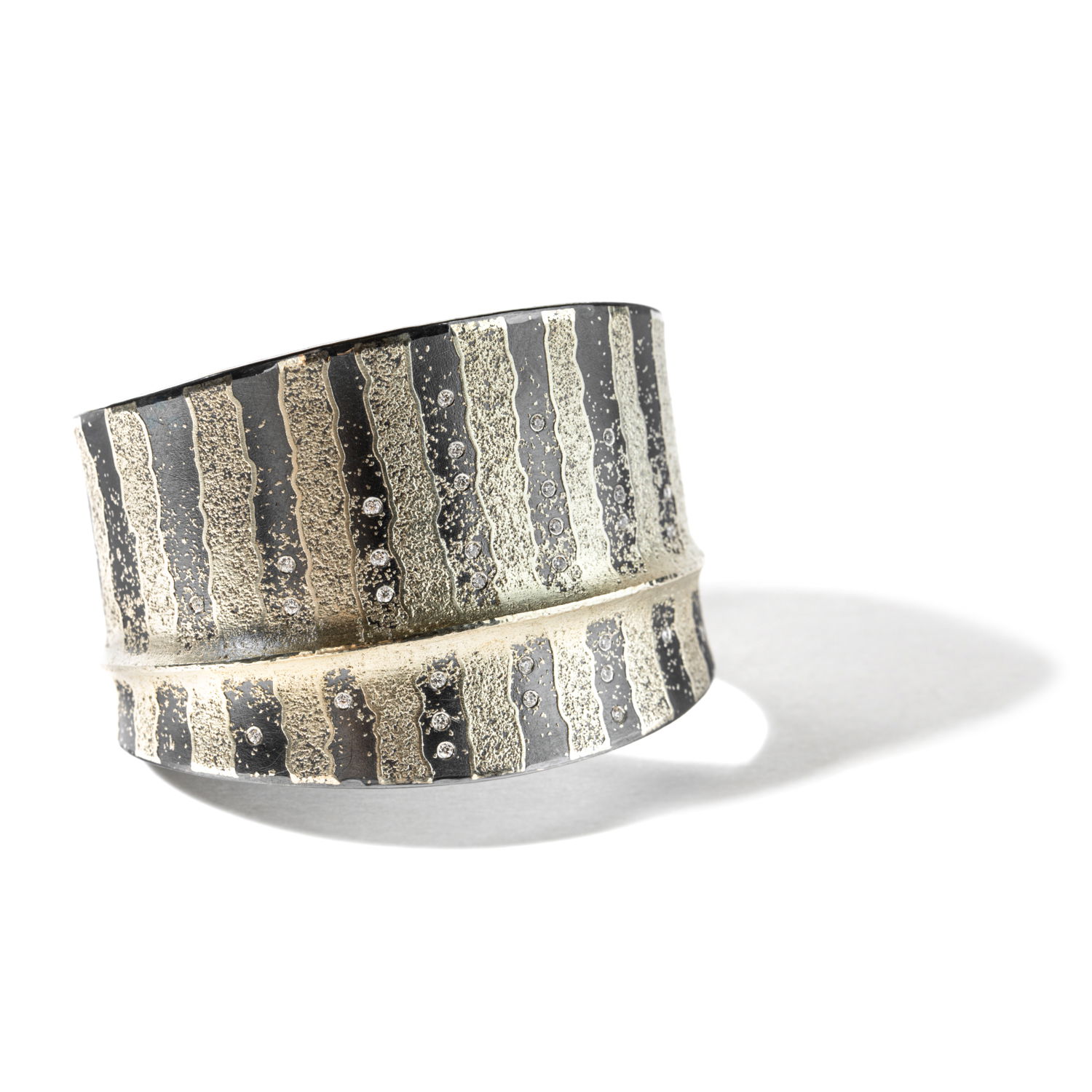 Level up your look with this stunning 24k yellow gold and sterling silver cuff with sparkling diamonds. This piece will make the perfect gift or treat for yourself.-24k Yellow gold-Sterling silver-Round diamonds, 0.32ctsItem# 808-2000347 Two-Tone Cuff