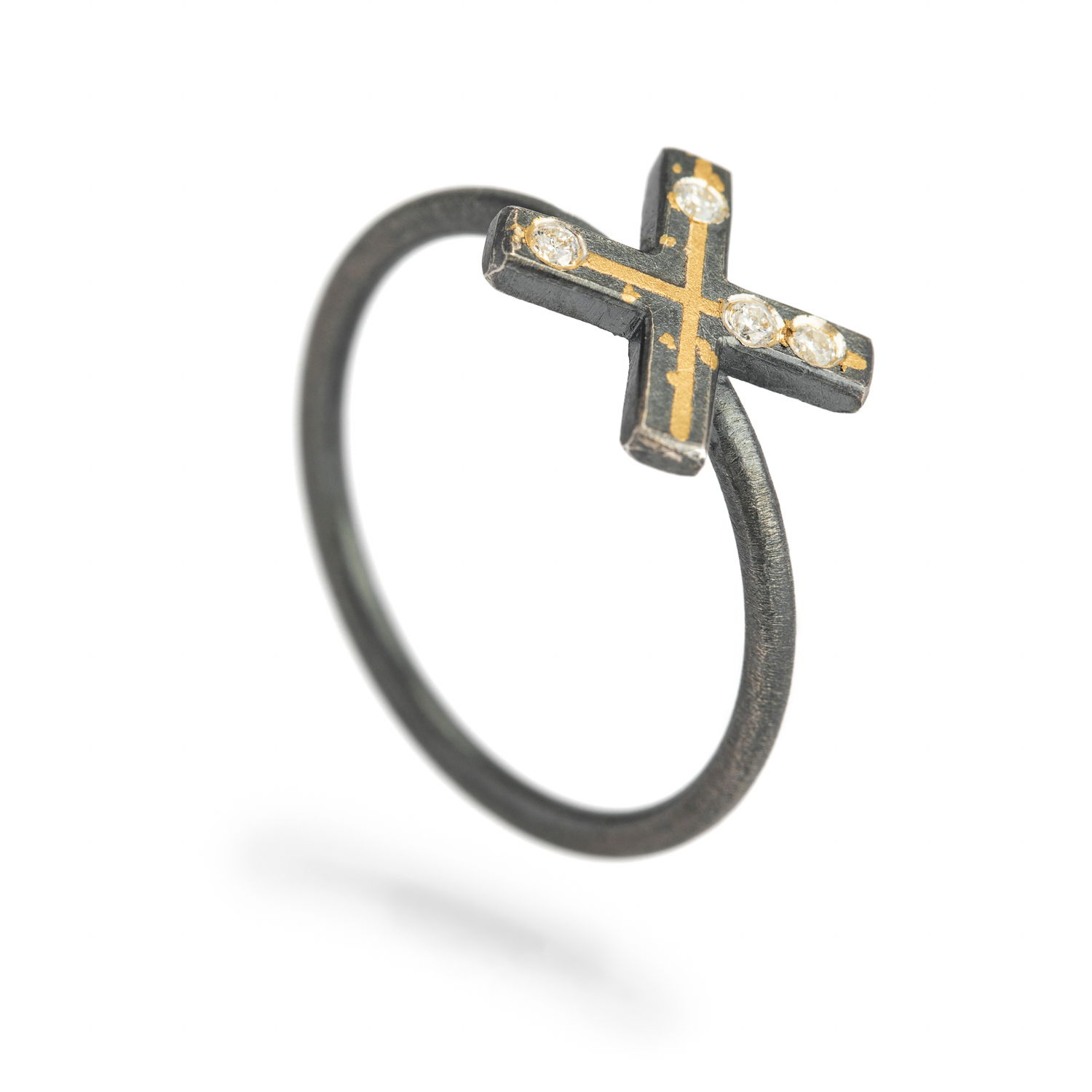 This sculptural ring features a bold 'X' motif in oxidized sterling silver, accented with hand-applied 24k yellow gold and set with shimmering white diamonds. Minimal in form but rich in texture, it’s a quiet statement with soulful depth.-Sterling silver and 24k yellow gold-Round diamonds, 0.04ctsItem# 804-2000355 'Kisses' Ring