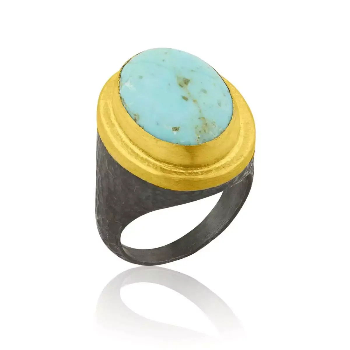 A bold fusion of ancient inspiration and modern craftsmanship, this “Pompei” ring features a vibrant oval Kingman turquoise set in rich 24k gold and oxidized silver. The natural stone’s vivid blue contrasts beautifully against the darkened silver, creating a piece that’s both striking and sophisticated.-Oxidized silver-24k Yellow gold-Kingman turquoise 13x18mmItem# 804-2000378 Pompei Ring in Turquoise