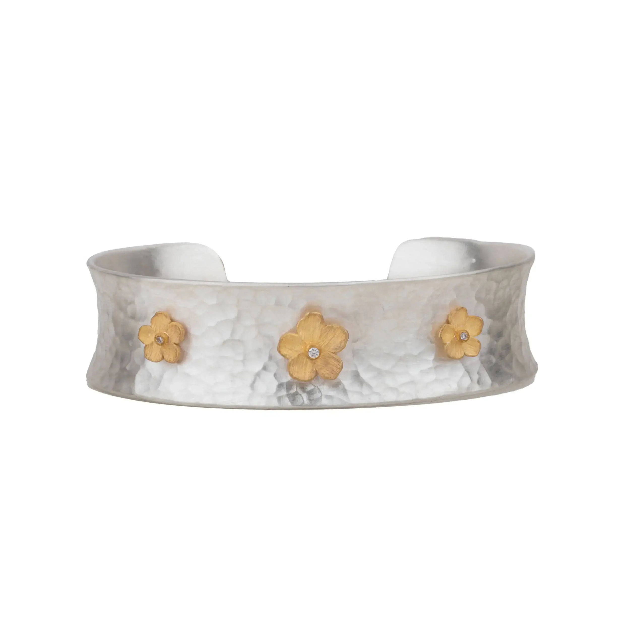 The Buttercup cuff blends strength with softness in a bold 16mm silhouette. Handcrafted in sterling silver with rich 22k gold detailing, this piece is finished with sparkling diamond accents for just the right amount of brilliance. -Sterling silver-22k Yellow gold-Diamonds, 0.03ctsItem# 808-2000358 Buttercup Cuff