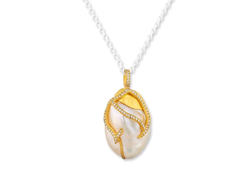Crafted in pure 24k gold, this timeless piece features a luminous freshwater pearl, hand-selected for its natural beauty, and accented with delicate diamonds for just the right touch of brilliance. Elegant and unique, the Lydia is more than jewelry—it’s a statement.-24k Yellow gold-Freshwater baroque pearl, 21x32mm-Chain sold separatelyItem# 807-2000432 Lydia Necklace