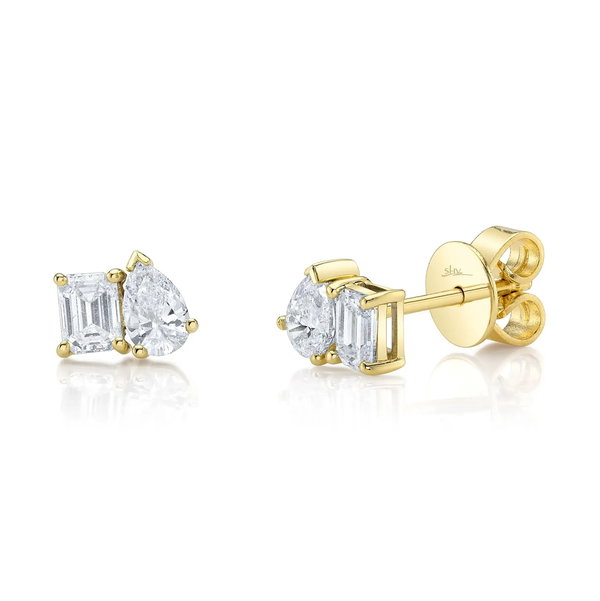 Closeup photo of Pear & Emerald cut Diamond Studs