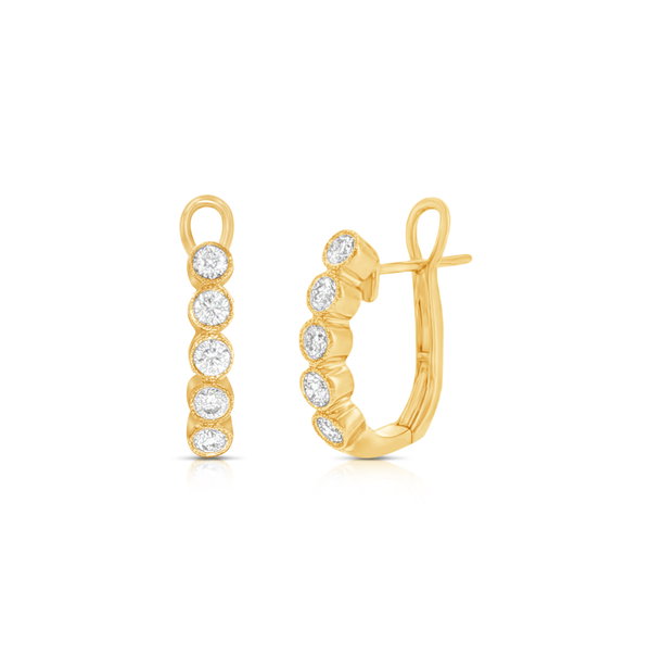 Closeup photo of Diamond Oval Huggie Earrings