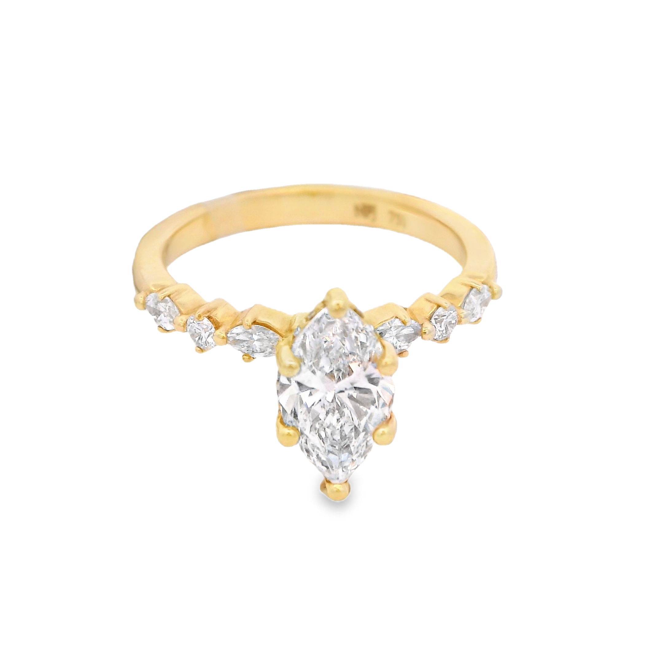 This 18k yellow gold engagement ring features a striking marquise diamond, accented by diamonds along the shank for added sparkle. Elegant and elongated, it's a distinctive choice for a love that stands out.-18k yellow gold-Marquise diamond, 1.12cts-Round diamonds, 0.47cts-Size 6.5, Contact for sizing optionsItem# 001-100-00899 Marquise Engagement Ring