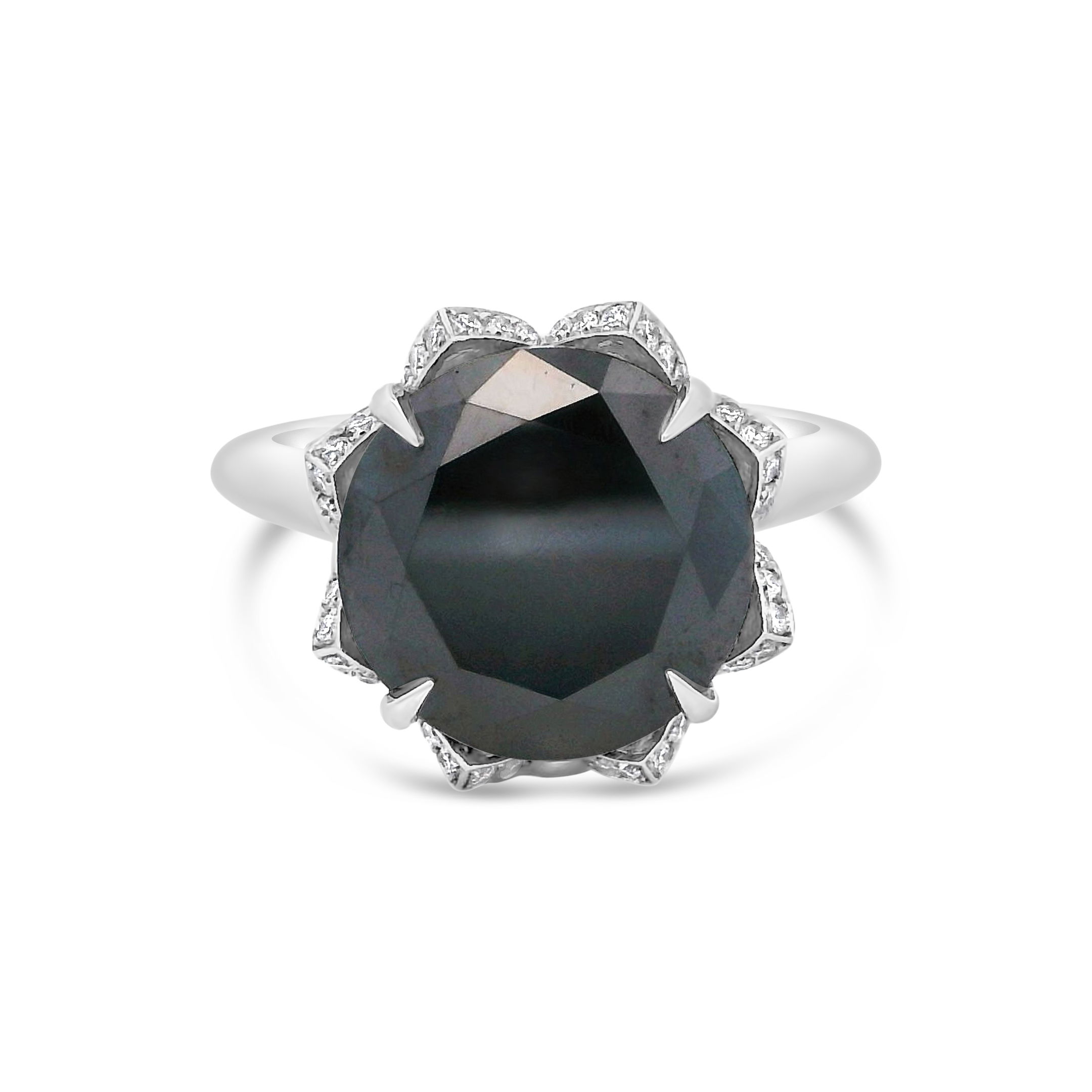 This stunning piece fits perfectly for engagement or fashion! With a striking black diamond center stone accented with marquise & round diamonds, this ring is a true head turner. Cicada atelier is located in the heart of the New York City jewelry district on 47th street, where each unique piece is meticulously handcrafted.-Platinum-Black diamond, 5.73ct-Round and Marquise diamonds, 2.00cts -Size 5.75, Contact for sizing optionsItem# 100-00967 Black Diamond Engagement Ring