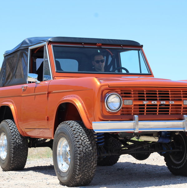 Closeup photo of 1967 Ford Bronco Cyber Orange Frame Off Restoration 5.0L Mustang Engine Duel Gas Tank