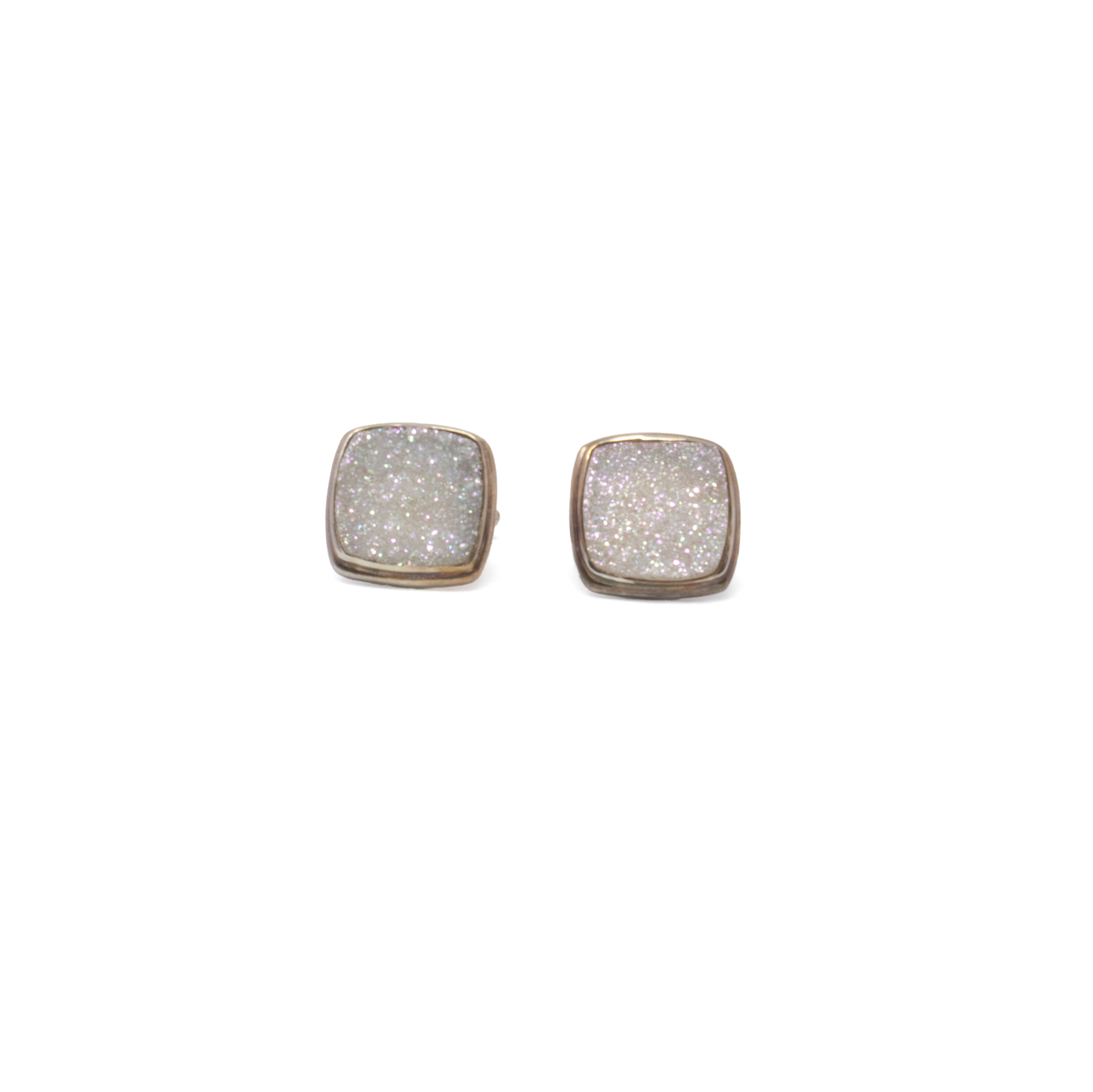 Elevate your formalwear with these Angel Aura Druze Square Cufflinks, showcasing genuine angel aura druze gemstones that shimmer with an ethereal spectrum of colors. Set in a refined 925 sterling silver step-edged frame, they blend durability with timeless elegance. Ideal for special occasions or as a unique gift, these cufflinks offer a distinctive sparkle for those who appreciate fine craftsmanship and standout accessories. Angel Aura Druze Square Cufflinks With Silver Step Edge
