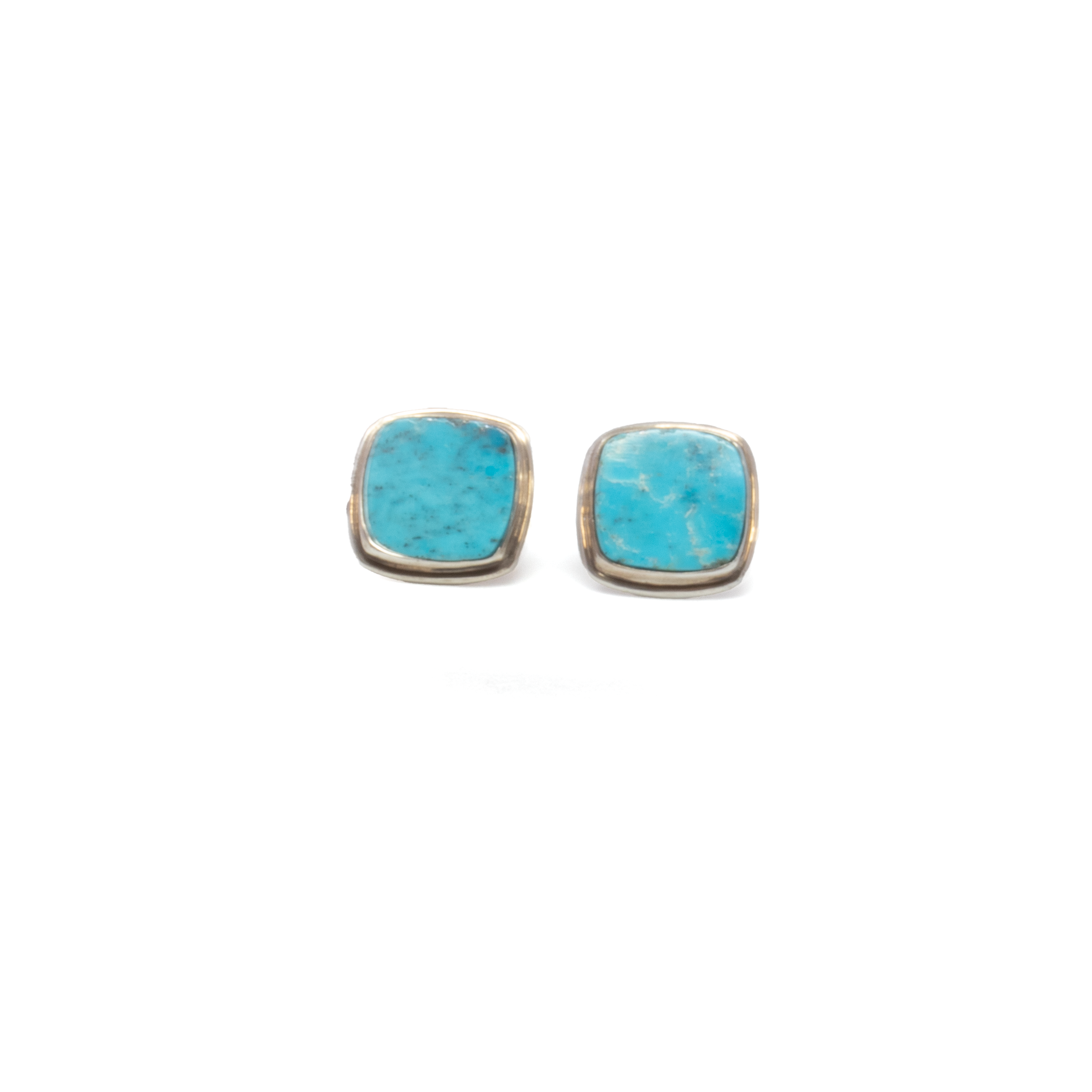 Elevate your style with the Nacozari Turquoise Square Cufflinks, showcasing vibrant, square-cut stones renowned for their vivid blue-green tones and intricate natural matrix. Set in sleek 925 sterling silver, each cufflink blends bold color with timeless refinement, offering a perfect balance of tradition and modern sophistication. Whether worn for a formal occasion or as a distinctive daily accent, these cufflinks make a confident, artful statement. An exceptional gift for those who appreciate heritage materials and contemporary design. Nacozari Turquoise Square Cufflinks With Silver Edge