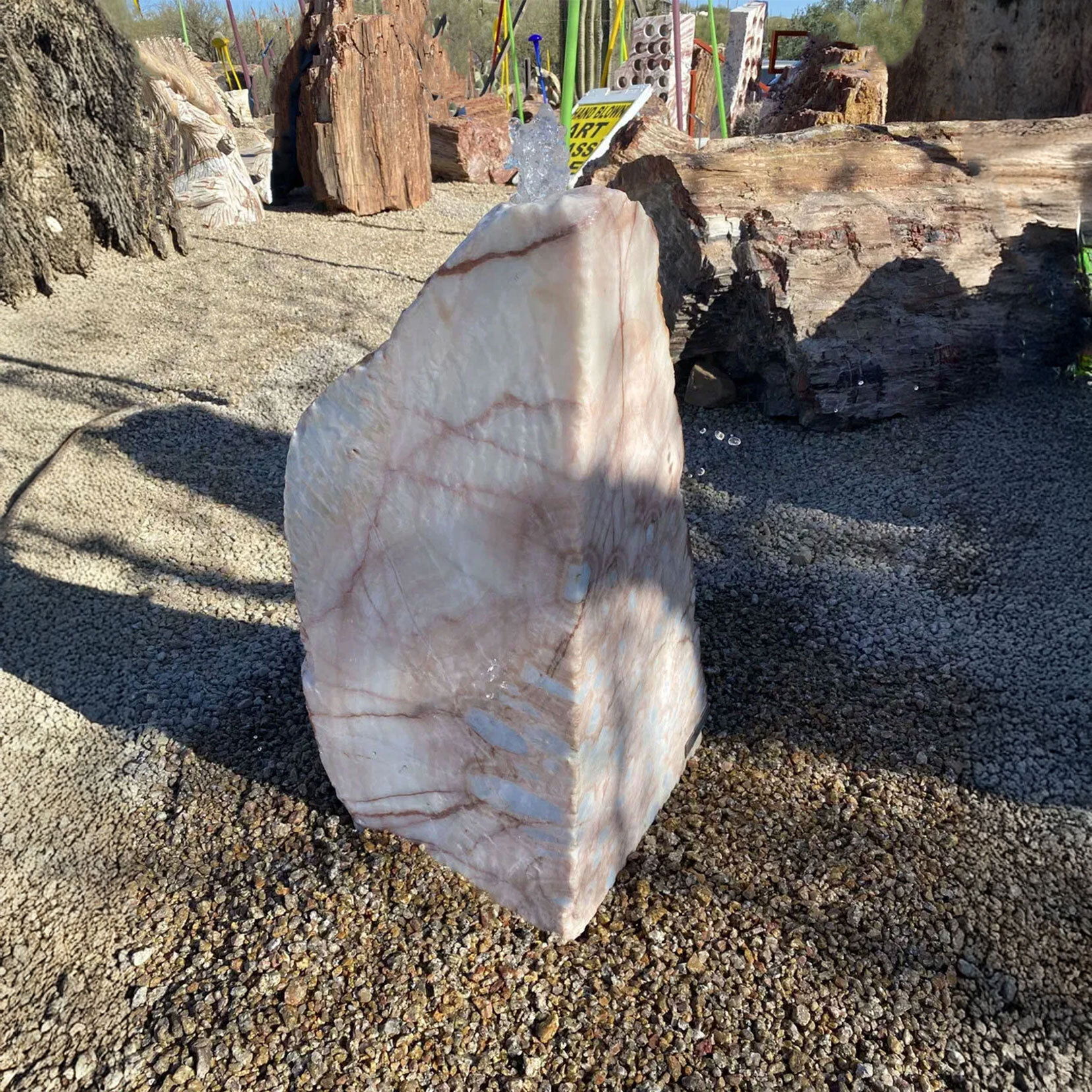 The Onyx Fountain in Cherry Blossom with Wedge Cut design adds a touch of elegance to any outdoor space. Its tranquil water flow promotes relaxation while enhancing the aesthetic appeal of your yard, garden, or patio. Let Rare Earth Gallery’s white-glove service make your fountain dreams come true—simply choose your fountain, tell us where it goes, and we’ll handle the rest, from delivery to installation. IMPORTANT: the purchase price listed is for the FOUNTAIN ONLY and DOES NOT INCLUDE the cost of a basin, pump, parts or installation. Before purchasing a fountain online, we STRONGLY recommend you call us at (480) 575-4360 for a FREE consultation to discuss these additional costs and schedule a pre-site inspection. Also, free shipping does NOT apply to fountains, please call for a quote. Onyx Fountain - Cherry Blossom With Wedge Cut