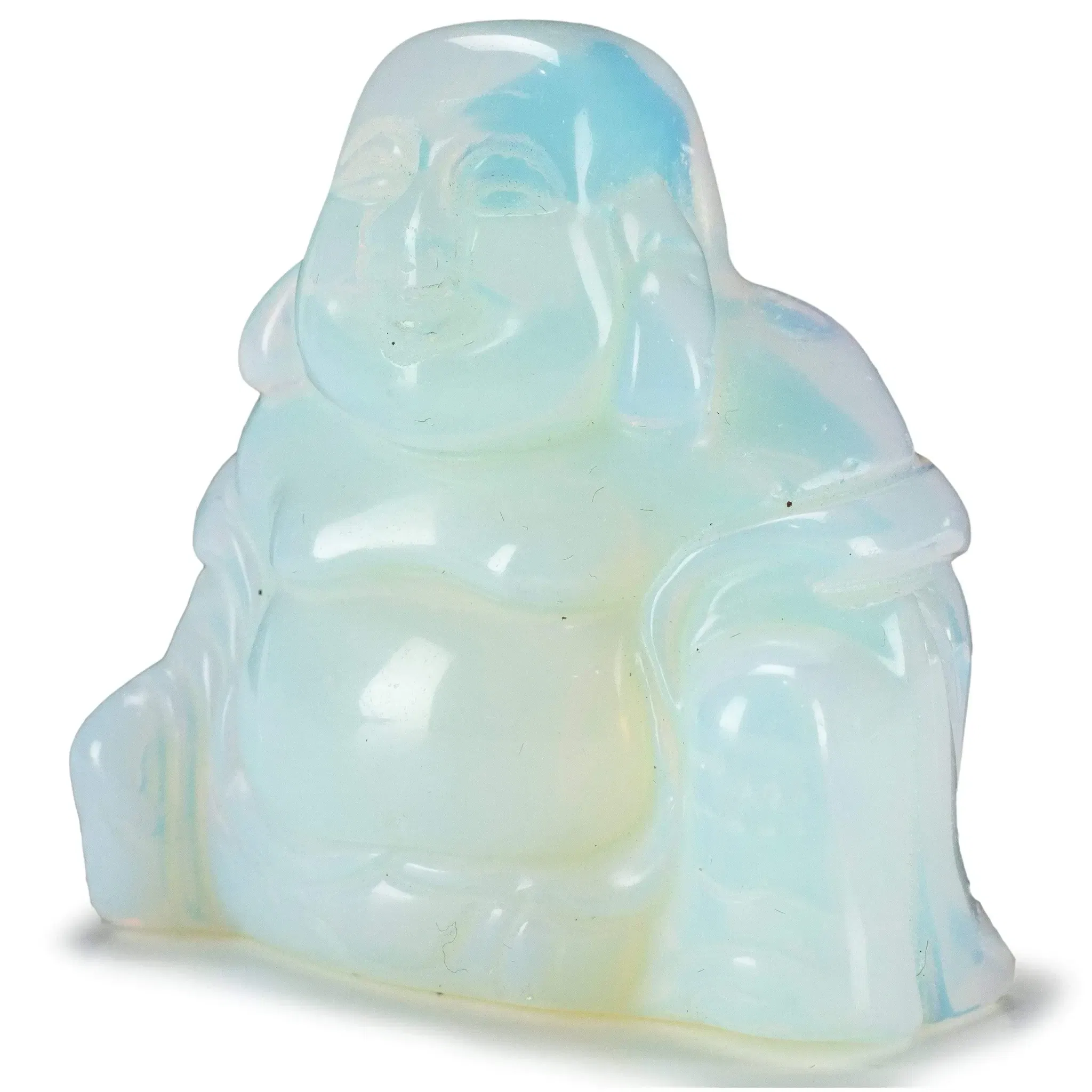 The Opalite Buddha Carving radiates a serene, luminous presence, blending spiritual symbolism with the ethereal glow of man-made Opalite. This delicately hand-carved figure captures the tranquil expression of the meditating Buddha, embodying calm, clarity, and inner peace. With shifting hues of soft blue and milky white that catch the light, the Opalite brings a celestial quality to the piece, enhancing its visual and energetic appeal.Ideal for a meditation altar, desk, or shelf, this sculpture adds a quiet elegance to any setting. Opalite is often associated with emotional balance and communication, making this carving both a decorative accent and a gentle reminder of mindfulness. A thoughtful gift for spiritual practitioners or admirers of symbolic art, the Opalite Buddha Carving is a timeless token of harmony and illumination. Opalite Buddha Carving