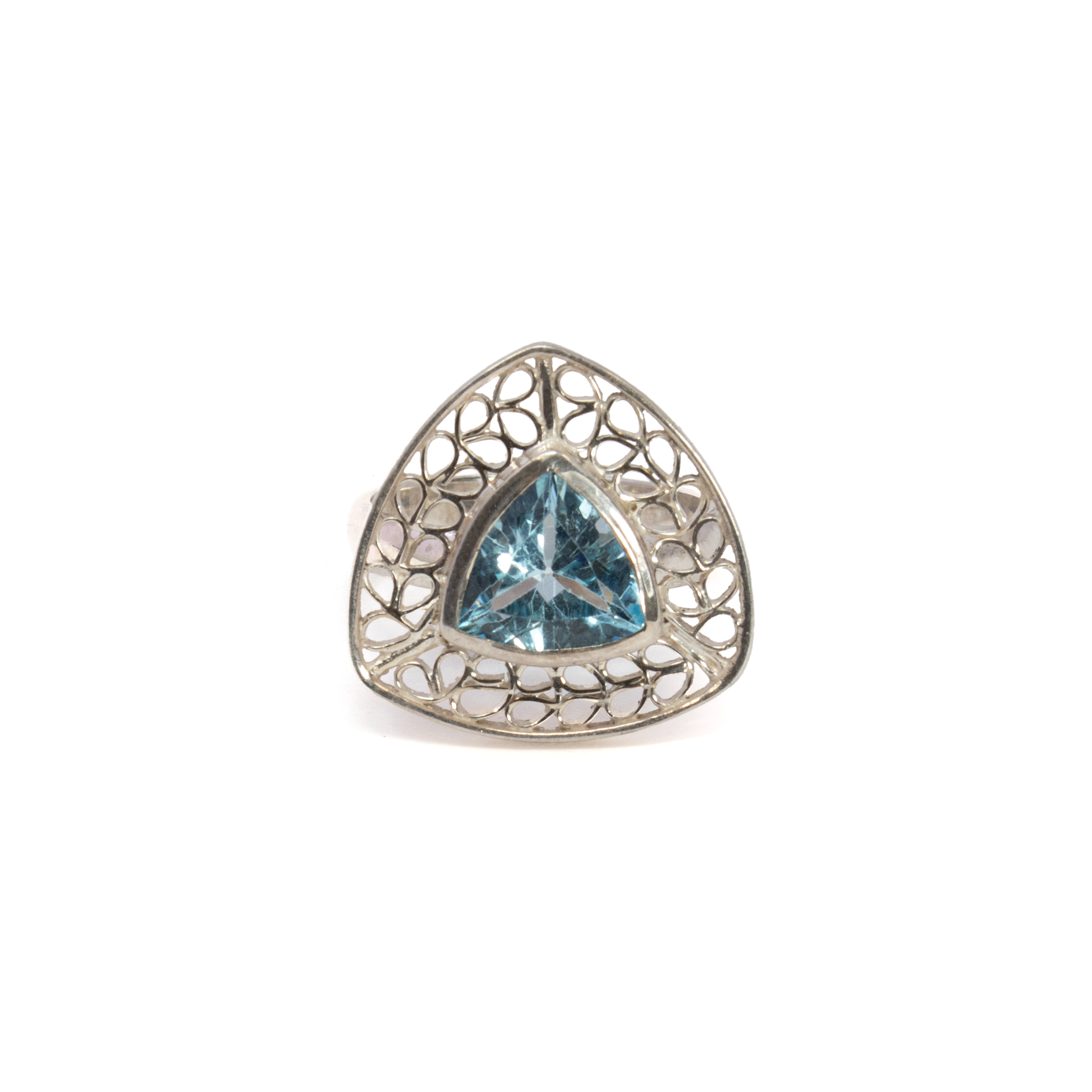 This extraordinary Blue Topaz ring features a captivating trillion-cut blue topaz, known for its brilliant sparkle and enchanting blue hue. The gemstone sits beautifully in a sleek silver bezel setting, accentuating its unique shape and remarkable clarity.Crafted with precision and care, the ring is made from high-quality 925 sterling silver, ensuring longevity and a timeless appeal. The intricate silver wire looped leaf design edge adds an element of artistic flair, seamlessly blending classic elegance with contemporary style. This sophisticated detail not only enhances the overall design but also creates a harmonious balance that complements the brilliance of the blue topaz.Perfectly sized at 8, this ring offers a comfortable and secure fit, making it an ideal accessory for any occasion. Blue Topaz Ring - Trillion With Silver Bezel & Silver Wire Looped Leaf Design Edge Sz8