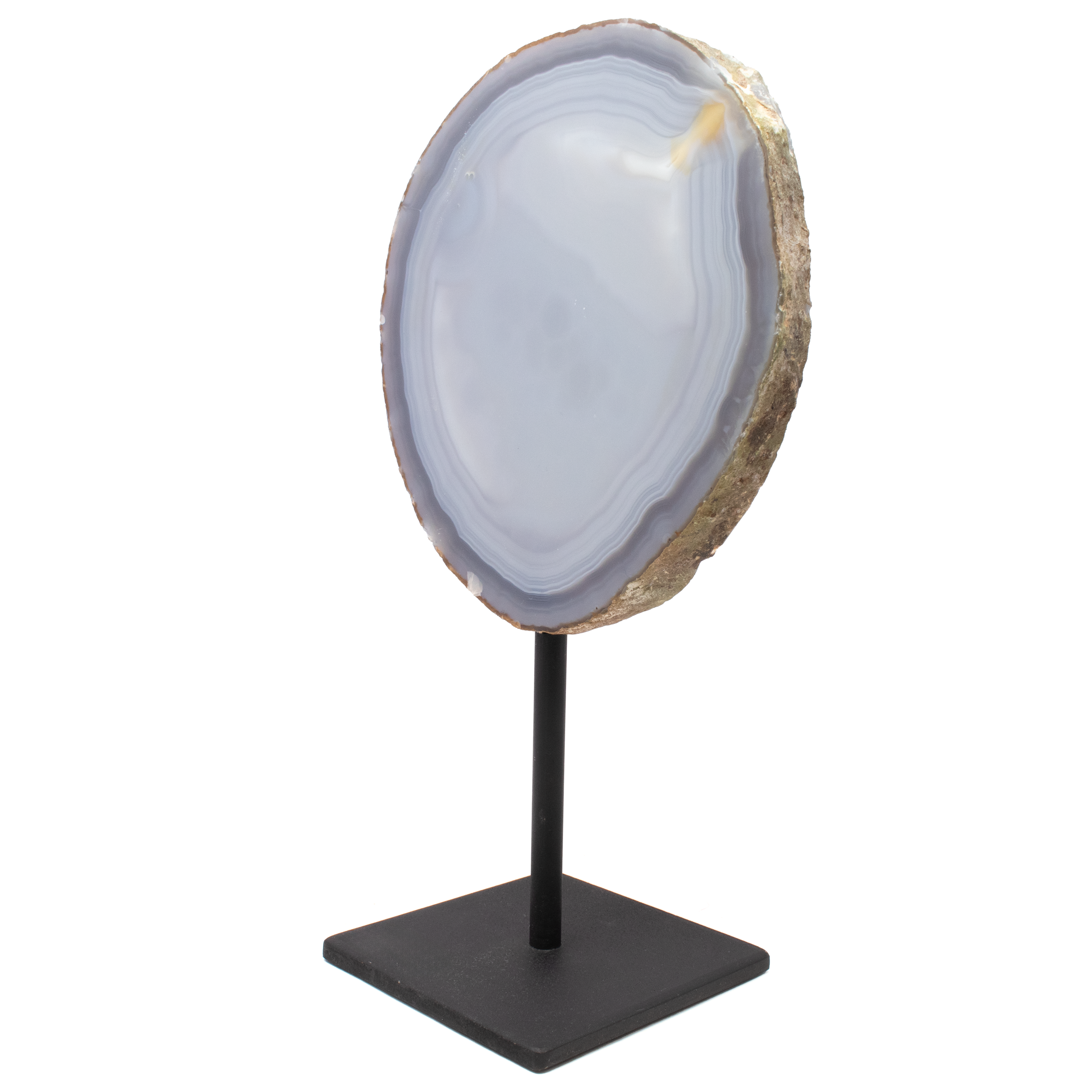 Elevate your home decor with the captivating allure of our Druze Geode on Metal Post Stand. This exquisite piece is a stunning home accessory that embodies the natural beauty and mystique of the Earth's treasures. The geode displays deep gray-blue bands that intertwine with dazzling crystals, creating a mesmerizing contrast. Its unique patterns and shades make each piece a one-of-a-kind treasure, ensuring that no two are exactly alike. Druze Geode On Metal Post Stand -Deep Gray Blue Bands With Carmel Exit Mark
