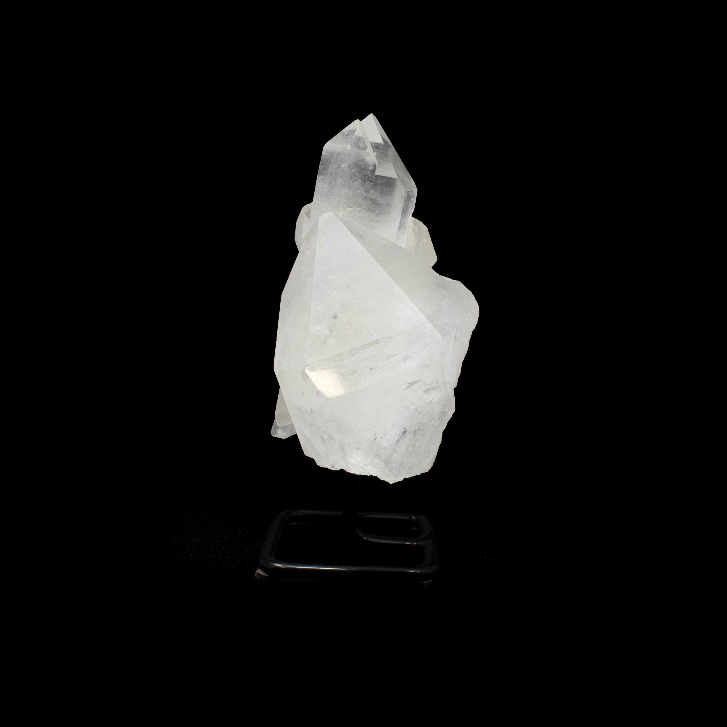Elevate your space with the ethereal beauty of the Quartz Point Cluster on Post Stand. This exquisite piece effortlessly combines the natural elegance of raw quartz crystals with a modern, minimalist stand, making it a stunning addition to any home or office décor.Each cluster is unique, showcasing the raw, organic formations of quartz points that capture and reflect light beautifully, creating an enchanting sparkle. Quartz Point Cluster On Post Stand